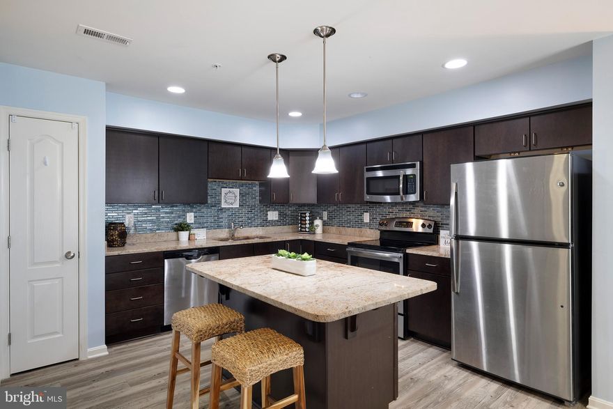 OPEN HOUSE ON 5/1/22 CANCELED!    ABSOLUTELY AWESOME in Eldersburg.  3 bedroom/ 3 bath stone front townhome in coveted Reservoir Ridge. Check out the live action video under Virtual Tour to see all the features!* 
Lovingly maintained, turn key Luxury townhome  in PERFECT location, location, location *Gorgeous Open Floor Plan, Luxury Vinyl Floors and Light-filled Living Spaces and High Ceilings*
**7 years young, and in amazing condition. * Welcoming, spacious and Pottery Barn designed**Kitchen features large island, granite counters, stainless steel appliances, beautiful backsplash, and pantry.* The living room boasts large windows, and ample area for your choice of seating, with half bath, coat closet and storage closet on this level.
The second level features 2 generously sized bedrooms with  that share a large bathroom with upgraded tile and linen closet. The laundry room has full sized stackable washer and dryer. 
The Owner's Suite is set apart on the third level. Huge and full of light, it is truly an oasis!* It has a large walk in closet- making living an orderly life easy, ceiling fan and linen closet too * The en-suite bathroom has double vanities, upgraded tile, separate shower and spa bath tub. 
You will notice the modern lighting throughout the home, as well as recessed lighting. * Custom blinds on all windows! *This home is every bit as pretty in person as it is in the photos and video, and full of builder upgrades. Truly Turnkey!
Community: outdoor pool, lawn care included, assigned parking and visitor parking. Walk to shopping and restaurants.
Open House on 4/30/22 from 12:00-3:00.
Schedule your showing TODAY!