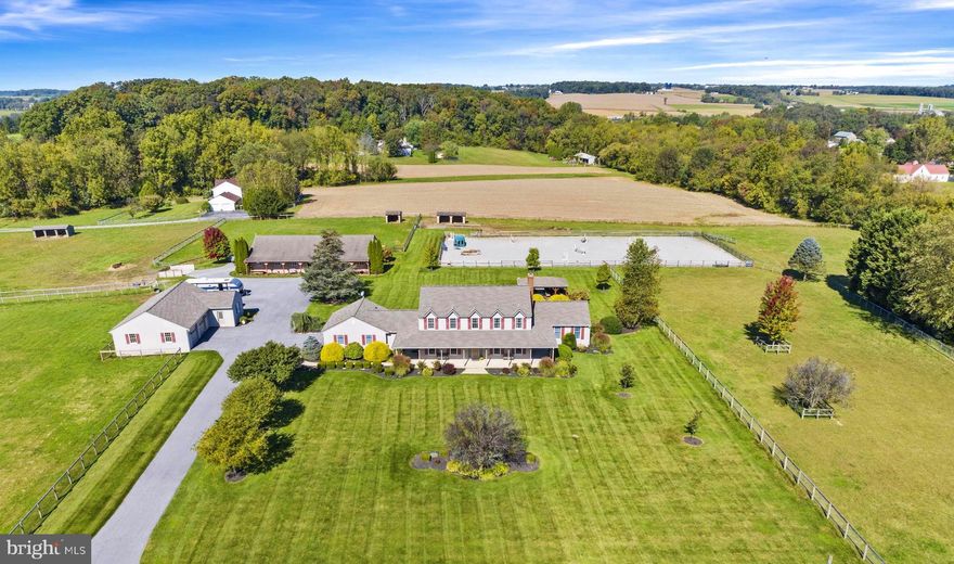 Nestled in the heart of scenic Cochranville, Pennsylvania, this exquisite property at 529 Center Hall Rd offers idyllic country living, serene view and charm. Welcome to a residence that embodies farmhouse elegance, spacious comfort, and timeless appeal. In addition to 3 bedrooms upstairs, a first-floor suite offers flexibility as another bedroom for yourself or a guest apartment with it's own entrance from the covered porch.
This exceptional property is a horse lover's paradise, offering an 8-stall barn with every equestrian convenience imaginable. Your horses will thrive in this spacious and meticulously designed haven.
Beyond the equestrian amenities, this remarkable property has undergone a transformative renovation that combines timeless charm with modern sophistication.
Updated Kitchen: The heart of this home has been thoughtfully updated to meet the needs of today's discerning homeowners. The light and bright kitchen features a large center island, quartz and granite countertops, stainless steel appliances, plus space for a gathering table by the windows offering a view of the pastures and ring.
In addition to the main residence and barn, a detached garage capable of accommodating 2+ vehicles and a workshop awaits your projects and storage needs. It features 3-phase electric and a separate meter. Whether you're a car enthusiast or a DIYer, this space offers endless possibilities.
For riders seeking to perfect their skills, the property boasts a professionally designed riding ring with sand footing, ensuring an ideal surface for training and enjoyment. Whether you're a seasoned equestrian or just starting your equestrian journey, this riding ring is a true gem. For those moments of relaxation and reflection, a charming gazebo overlooks the riding ring, providing a tranquil spot to watch your horses in action or simply enjoy the scenic beauty of the property.
Equestrian enthusiasts will also appreciate the property's proximity to world-class equestrian venues. Join this vibrant equestrian community and easily access renowned competitions, events, and training facilities in the area. 
Step outside onto the inviting wrap-around porch, where you can savor the serenity of the countryside while taking in picturesque views of your property. This outdoor oasis is perfect for morning coffee, evening sunsets, or leisurely gatherings with friends and family.
Hardwood Floors: Throughout the main living areas, you'll find beautifully refinished hardwood floors that exude warmth and character, complementing the home's overall inviting ambiance. You will love the easy maintenance of tile at the side entrance and kitchen. 4 Bedrooms: This spacious home offers four bedrooms, providing plenty of room for family, guests, or a dedicated home office.
3 and 1/2 Baths: With 3 full baths and an additional half-bath, convenience and comfort are always at your fingertips. 
 Main Floor Laundry: Enjoy the convenience of main floor laundry facilities. 
Large dry basement with high ceilings and an outside entrance - ready to finish as you wish or simply use for storage.
The transformation of this property combines the charm of the past with the comfort of the present, creating a home that is truly exceptional. Whether you're a horse enthusiast,  hobbyist or simply seeking a place to call your own, this property is a must-see.
Don't miss the chance to experience the best of country living in style. Schedule your private viewing today and make this captivating property your own!