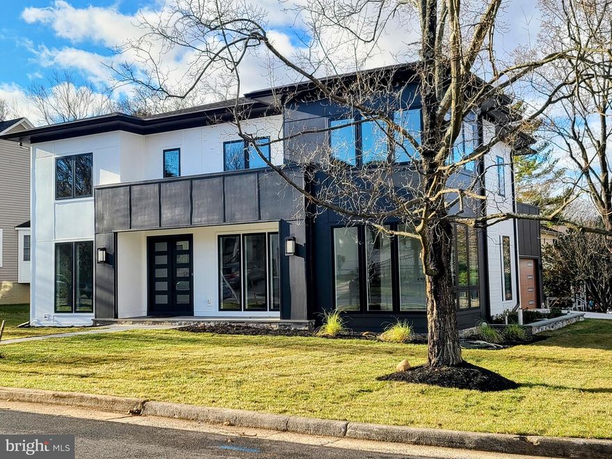 STEP INTO A WORLD OF ELEGANCE AND COMFORT - Welcome to this extraordinary custom-designed home, thoughtfully curated with impeccable attention to detail and the finest quality craftsmanship. Spanning  nearly 6,000 square feet, it boasts six bedrooms with en-suite bathrooms, 2 elegant powder rooms and a 2-car garage. The residence combines modern convenience with timeless design, creating the perfect setting for both luxurious living and everyday functionality. A STUNNING FIRST IMPRESSION - As you enter through the elegant foyer, you're greeted by 10-foot ceilings, exquisite tray and suspended ceiling designs, and light oak flooring that flows seamlessly throughout the main level. Modern lighting accents create an ambiance that is both inviting and sophisticated—ideal for hosting elegant soirées or enjoying quiet family moments. CULINARY DREAMS COME TO LIFE- The Chef's kitchen is nothing short of spectacular, featuring state-of-the-art Thermador appliances, quartz countertops, and a butler's pantry complete with a beverage center and expansive walk-in pantry. A sprawling center island with seating takes center stage, connecting effortlessly to a sunlit breakfast nook framed by floor-to-ceiling windows. Adjacent to the kitchen, the family room boasts a cozy fireplace and opens via accordion doors to a screened-in porch, wired for entertainment and relaxation—ideal for gatherings or relaxing evenings. MAIN LEVEL VERSATILITY - The main floor also offers a secluded guest suite with an en-suite bath, a chic powder room, and a functional mudroom with  a spacious family coat closet, built-in cubbies and a sink, leading to the attached two-car garage. Every detail is designed to enhance comfort and practicality. YOUR PRIVATE RETREAT - The upstairs owner's suite is your personal sanctuary. Indulge in a spa-inspired bathroom equipped with dual rain showers, handheld fixtures, a stand-alone soaking tub, and dual vanities, all complemented by a massive walk-in closet and a private terrace. Each of the additional three bedrooms features its own en-suite bath, ensuring comfort and privacy for all. A spacious, fully outfitted laundry room adds convenience to this level. ENTERTAINING MADE EASY - The lower level is designed for leisure, featuring a sprawling recreation room with a wet bar, a  media room, a guest powder room, and an additional bedroom with a full bath. Whether hosting guests or enjoying a quiet night in, this space is ready to accommodate any occasion. MODERN LIVING AND CONVENIENCE - This stunning six-bedroom residence is equipped with a surround sound and security system. Located with easy access to I-66, I-495, East and West Falls Church Metro Stations, and top-rated McLean schools, it provides both luxury and accessibility. SCHEDULE YOUR PRIVATE TOUR TODAY -  Discover the blend of style, functionality, and convenience that makes this home truly exceptional. Contact us to schedule your private tour and see it for yourself.