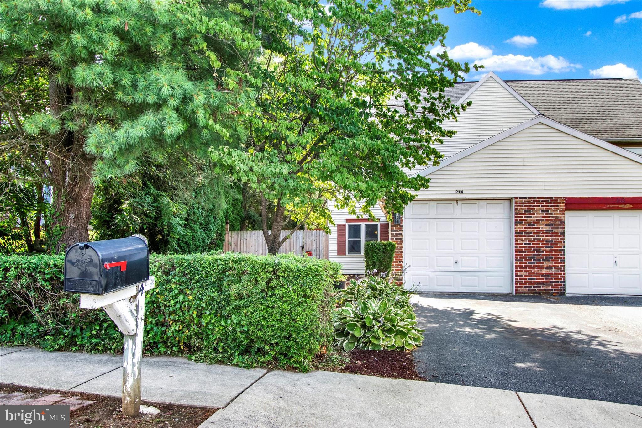 ***Open House Sunday September 28th from 5pm to 6pm.*** Charming 3-Bed, 2.5-Bath Semi-Detached Home in Womelsdorf / Conrad Weiser School District. Welcome to 214 S 4th Street – a warm and inviting 3-bedroom, 2.5-bath home nestled on a lovely garden-filled lot. This well-maintained semi-detached property offers a comfortable layout and peaceful outdoor spaces, perfect for everyday living. Inside, you'll find parquet flooring in both the living and dining rooms. The kitchen and dining area feature chair rail accents and a sliding glass door that opens to a beautiful backyard and side yard. A convenient powder room and laundry area are located on the main level. Upstairs, the second floor offers two nicely sized bedrooms—one with a walk-in closet—and a full hall bath. The private third-floor master suite includes two large double closets and its own full bath. Outside, the fenced backyard is a true retreat with a small stone patio, storage shed, pond, pergola covered in grapevines, and plenty of blooming flowers, shrubs, and mature trees for shade. Parking is easy with a one-car garage, driveway parking and additional off-street space. Don’t miss your chance to enjoy this peaceful setting in a convenient Womelsdorf location!