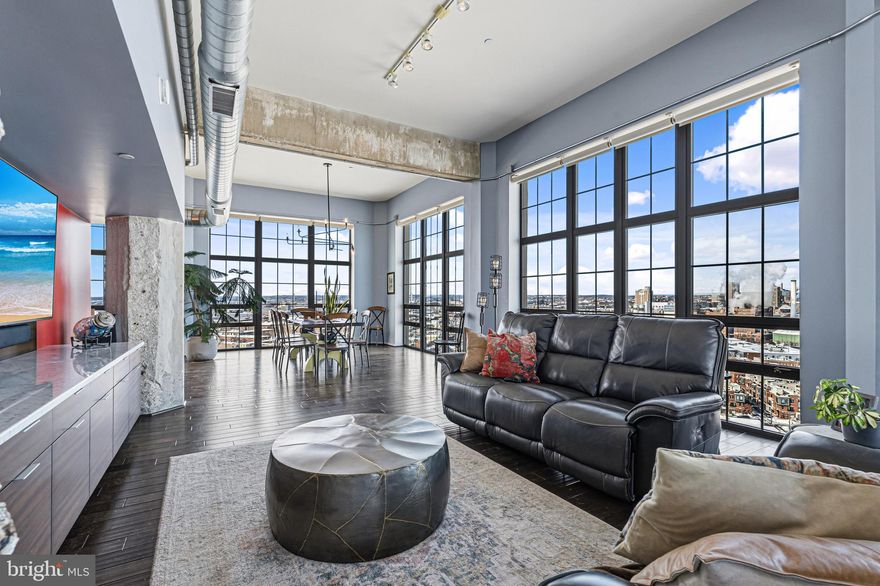 Fourteen-foot ceilings, dramatic floor-to-ceiling windows, and a wide-open floor plan create an incredible sense of volume, all framed by breathtaking views. The home has been extensively upgraded with Viking appliances, expanded custom cabinetry and pantry storage, integrated AV and whole-home sound, custom built-ins in the living room, and automated electric blinds throughout.
The primary suite features a fully remodeled spa-inspired bath with heated floors and an oversized custom walk-in closet. Located in Silo Point, residents enjoy 24/7 front desk service, a state-of-the-art fitness center, game and billiards room, sky lounge, meeting space, guest parking, and two secure parking spaces included with the residence.