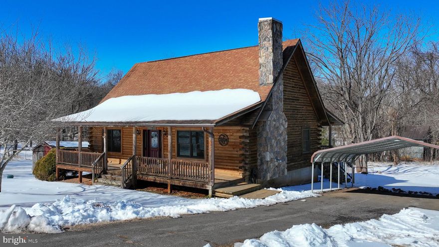 Welcome to this charming log home offering warmth, character, and everyday convenience just minutes from the Town of Orange. This 2-bedroom, 2-bath home with loft features an open floor plan and sits on 1.86 acres, providing a sense of privacy while still enjoying a neighborhood setting. Both bedrooms serve as primary suites, offering comfort and flexibility for owners and guests alike. The home showcases beautiful hardwood floors throughout the main level, a cozy indoor pellet-burning stove (conveys as-is), and covered front and rear porches perfect for relaxing outdoors. Multiple outbuildings provide additional storage or workspace options. Property is serviced by public water and trash collection, with a private septic system in place. A wonderful opportunity to enjoy rustic charm with the convenience of nearby town amenities.