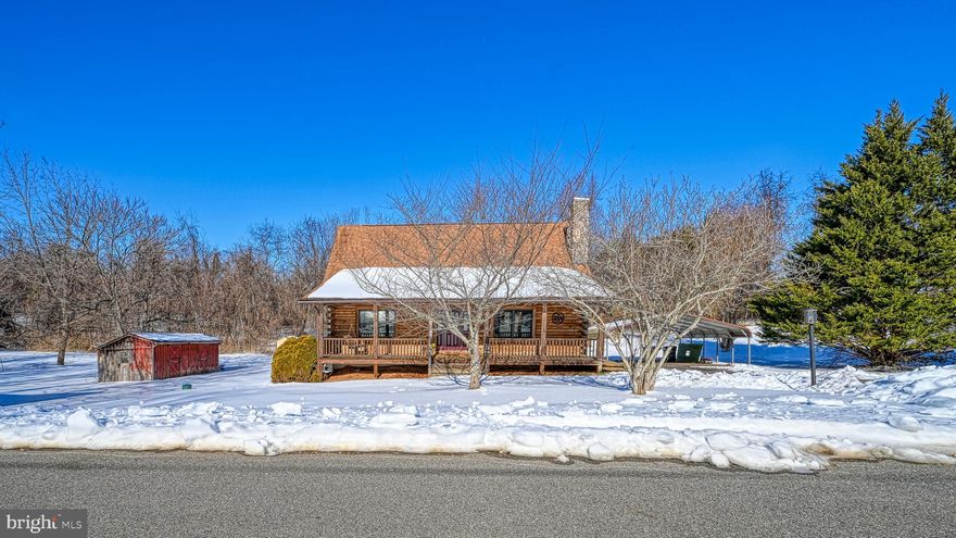 Welcome to this charming log home offering warmth, character, and everyday convenience just minutes from the Town of Orange. This 2-bedroom, 2-bath home with loft features an open floor plan and sits on 1.86 acres, providing a sense of privacy while still enjoying a neighborhood setting. Both bedrooms serve as primary suites, offering comfort and flexibility for owners and guests alike. The home showcases beautiful hardwood floors throughout the main level, a cozy indoor pellet-burning stove (conveys as-is), and covered front and rear porches perfect for relaxing outdoors. Multiple outbuildings provide additional storage or workspace options. Property is serviced by public water and trash collection, with a private septic system in place. A wonderful opportunity to enjoy rustic charm with the convenience of nearby town amenities.