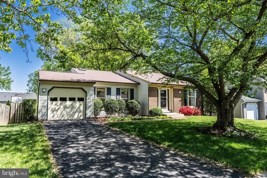 DEADLINE OF SUNDAY, May 4  at 5 pm.  Welcome to a place where every season feels special! Nestled in the heart of Kingston Chase, this 3-bedroom, 2.5-bath home is filled with thoughtful updates, inviting spaces, and a vibrant community just outside your door. Step inside and feel the easy flow of the open-concept kitchen and living area, designed for everyday living and effortless entertaining. The kitchen is a dream with hardwood floors, recessed lighting, tons of cabinet storage, a skylight, and a sunny eat-in space with a charming window seat. Vaulted ceilings add to the airy feel of the living room, making it a cozy yet spacious spot to relax. Upstairs, the primary bedroom is a true retreat, featuring a built-in dresser, a ceiling fan, barn doors, and a sizable walk-in closet with built-ins to keep everything beautifully organized. The attached primary bathroom offers a spa-like experience with a beautifully tiled walk-in shower. Two additional bedrooms, each with ceiling fans, share an updated full bath. The walk-out lower level extends your living space with a wood stove framed by a brick surround, recessed lighting, a built-in desk area, a convenient half bath, and a laundry room with front-loading washer and dryer. Slide open the 8-foot glass doors to your stone patio and fenced backyard, the perfect spot to enjoy the outdoors. In spring, the cherry tree and perennial gardens put on a spectacular show! Additional perks include a one-car garage, a brick walkway leading to the front door, and a storage shed for all your extras. Plus, you will love living in Kingston Chase, known for its community amenities, friendly vibe, and unbeatable location. This move-in ready gem is waiting to welcome you home!