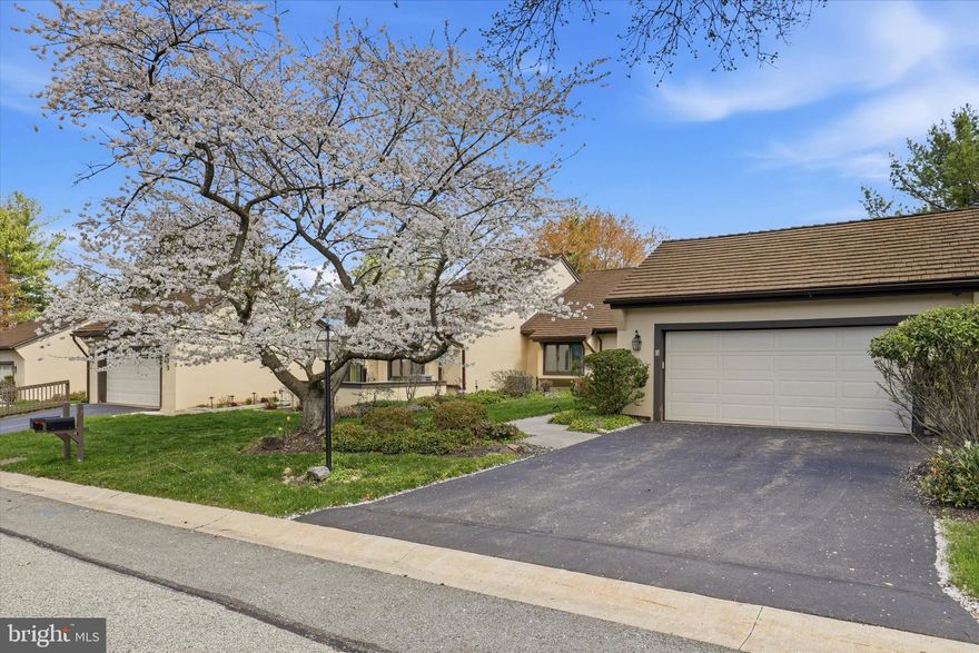 Are you ready to downsize to the simple life? Are you ready to give up lawn mowing, snow shoveling, landscaping but still have room to have a garden of your own if you want? Are you ready to enjoy life with the security of a gated 55+ community, conveniently located to downtown Ambler with its shops, theaters and restaurants? If this is what you have been waiting for, then the time has come to make the move to Whitpain Farm. The Whitpain Farm community is situated on 120 acres of meadows with a gated front and back entrance. Three Hounds Run Lane is a Narcissa model with lovely views of open meadows from many vantage points throughout the home. The walk up to the front door has mature flowering gardens. Entering into this home you are greeted with a light and bright foyer with skylights. The foyer opens to a living room with attractive and useful built-ins and a gas fireplace. The living room has new, neutral carpeting, crown and chair moldings and freshly painted walls. There is a sliding glass door to carry the entertaining to the large patio area. The living room leads to the formal dining room with crown and chair moldings, new carpeting and a sliding door to the side patio that wraps around to the larger patio. Perfect for outdoor entertaining. The eat-in kitchen has granite counters, a gas cooktop on the island, wood cabinets, under cabinet lighting and matching white appliances. The kitchen has tons of light with three skylights. Sliders lead to a new deck and new fenced area where you can enjoy a peaceful cup of coffee. Off of the kitchen is a laundry room and egress to the two-car garage. To the left of the light and bright foyer are the bedrooms. The primary bedroom suite has new carpeting, a ceiling fan, a great window seat, and sliding glass door to a patio. The bath has a tub and walk in shower, a dressing room and a spacious custom closet. The second bedroom or den, has the same new carpeting, built in cabinetry and two closets. One of the closets has a built-in desk area, great for keeping office clutter out of sight. There is a full finished basement with neutral carpeting. Plenty of storage space. The community of Whitpain Farm has many amenities. Besides the tennis and pickle ball courts there is a beautiful pool. There are plenty of open spaces and walking areas. The Manor House is a community farm house where residents can play cards, mahjong or have parties. The community garden located near the Manor House is used and appreciated by many residents and some of them will even share their flowers and produce. 
Whitpain Farm is a community you will love. Come live the simple life at Whitpain Farm.