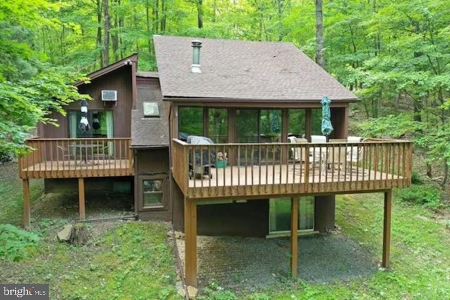 OPEN FLOOR PLAN, INCOME POTENTIAL, PRIME LOCATION!!!  Welcome to 170 Whipporwill Way, Berkeley Springs, WV 25411 — located in the peaceful and scenic Coolfont Mountainside subdivision. This well-maintained single-family home offers 1,856 square feet of living space with 3 bedrooms and 2 bathrooms, providing a functional floor plan suitable for full-time living, weekend getaways, or income-producing vacation rentals. The home sits in a wooded neighborhood known for its natural beauty and tranquil setting. The Coolfont Mountainside community is a popular retreat destination, and its proximity to trails, parks, and local attractions makes it ideal for owners and guests looking to enjoy a connection to nature while remaining close to the amenities of Berkeley Springs. The home’s interior includes an open living, dining, and kitchen area with large windows and sliding glass doors that bring in natural light and views of the surrounding trees. The kitchen is fully equipped with ample cabinetry, countertop space, and essential appliances. The layout supports both everyday use and hosting guests. Each bedroom offers closet space and views of the wooded lot, while the two full bathrooms provide convenience for residents and visitors alike. There is a deck space off the main living area, perfect for relaxing outdoors or entertaining. Whether used as a private residence or as a rental property, this home has features geared toward comfort and ease of use. Additional highlights include electric baseboard heating throughout the home as well as a woodstove to warm you on those upcoming, chilly fall and winter evenings. The main level laundry closet featuring a stackable washer and dryer provides convenience for full-time residents and guests. Situated in Coolfont Mountainside subdivision, the property offers access to a network of nature trails and green spaces. Located nearby is the White Trail - Trailhead off Dogwood Lane, just a short distance from the home. This trail provides opportunities for outdoor recreation and nature exploration throughout the seasons.  Also located within the subdivision is a community pool, hot tub, tennis courts, and much, much more! A short drive from the property leads to more outdoor recreational opportunities, including Berkeley Springs State Park, located about 6.6 miles away. This historic park features warm mineral springs and spa services. Also nearby is Cacapon State Park, less than 8.5 miles away, where visitors enjoy hiking trails, fishing, golf, and a variety of seasonal activities. Berkeley Springs is known for its blend of small-town charm and natural amenities. The town center features local shops, restaurants, art galleries, and the famous mineral spas that date back to colonial times. Residents and tourists alike enjoy the relaxed pace of life while having access to practical services and entertainment options. This property also presents a strong opportunity for rental income. The combination of an established tourist destination, the peaceful location within the Coolfont Mountainside community, and the home’s practical features make it appealing to short-term renters. Whether you’re looking to invest in a vacation rental property or secure a secondary home with income-producing potential, 170 Whipporwill Way is a valuable option. Don't miss your chance to own a home in one of Berkeley Springs' most desirable subdivisions!