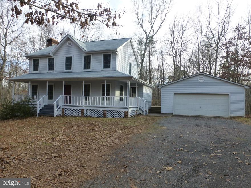 Beautiful two story colonial home located on a private wooded lot. Large rear deck and cozy screened in porch with secluded views perfect for outside gatherings. Spacious living room with a charming brick fireplace and sizeable kitchen with lots of room for comfortable dining. Gorgeous renovated master bath with separate shower and tub. Large garage with extra room for storage and projects!
