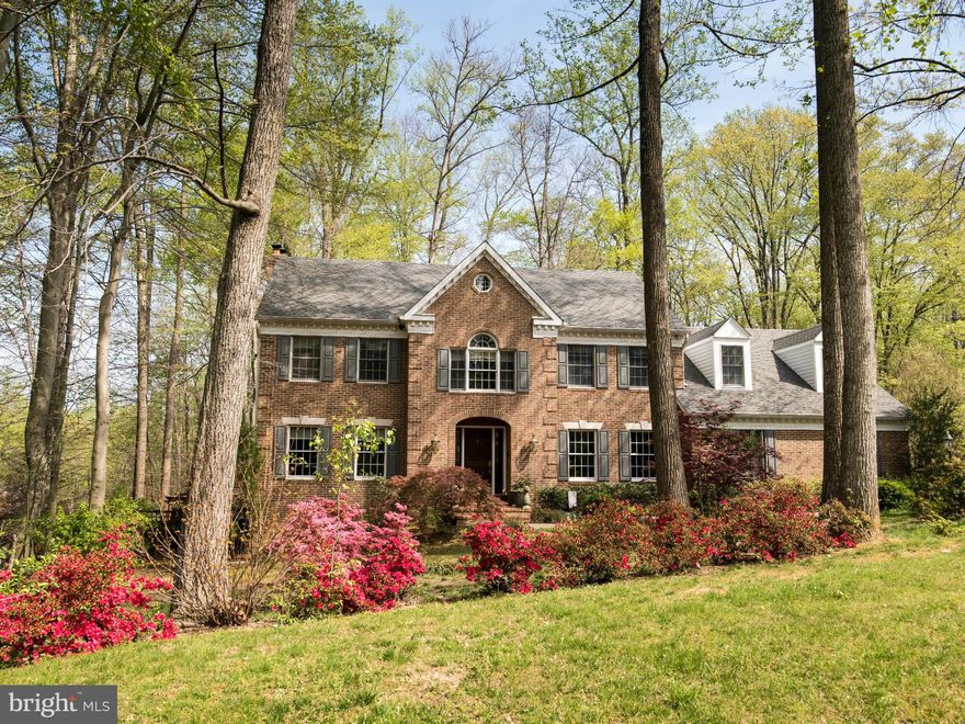 Stunning brick front colonial on nearly two acres, a nature lovers dream!  You'll enjoy the outdoor living space on this private lot with mature trees and breathtaking views.  5BD/3FB/2HB.  Highlights include: gleaming hardwood floors, main level bedroom suite, master bath spa retreat, granite counter tops, stainless appliances, french doors, custom window treatments, crown molding and NO HOA!