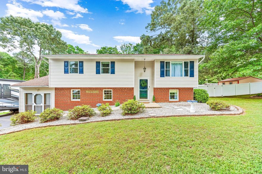 ****Highest and Best Offers Due by Friday 6/17 @ 2:30PM****In-Ground POOL! Well maintained 4 bedroom 2.5 bathroom split foyer w/ a 1-car garage, half acre flat lot, and diving depth inground pool in LEONARDTOWN HIGH SCHOOL district! Driving up you are greeted by great curb appeal! A large flat front yard w/ nice landscaping and a long paved driveway are added bonuses! Inside the main living areas have been updated with luxury vinyl plank flooring. A good sized living room, dining room, & kitchen are the heart of the home. The kitchen has been updated with granite countertops & high-end stainless steel appliances including a gas range w/ a double oven! Just down the hall are 3 bedrooms and 2 bathrooms. The primary bedroom is ample sized and has an updated en-suite full bathroom. The lower level is home to a very large rec room that is perfect for entertaining. A wood stove is a nice feature to have to heat the home during the winter! A small bar area has a built-in mini fridge to keep your cold drinks close! The 4th bedroom is the size of 2 bedrooms, has a large closet, & an attached half bathroom. The back yard is the real show stopper here! A 6' Vinyl Privacy fence and the wooded back ground make this feel like your own private oasis. A large deck steps down and meets a smaller deck off of the basement and then leads to a poolside deck/patio which includes a tiki bar w/ electric and a kegerator! A 30,000 gallon 9' deep diving pool is the perfect place to relax during the hot summer! The yard feels massive with a large grassy area to compliment the patio/deck entertaining areas. Plenty of outdoor storage with the two large sheds, one serving the pool area and the other one for yard tools. This home has so much to offer! Do not hesitate or you may miss this opportunity!