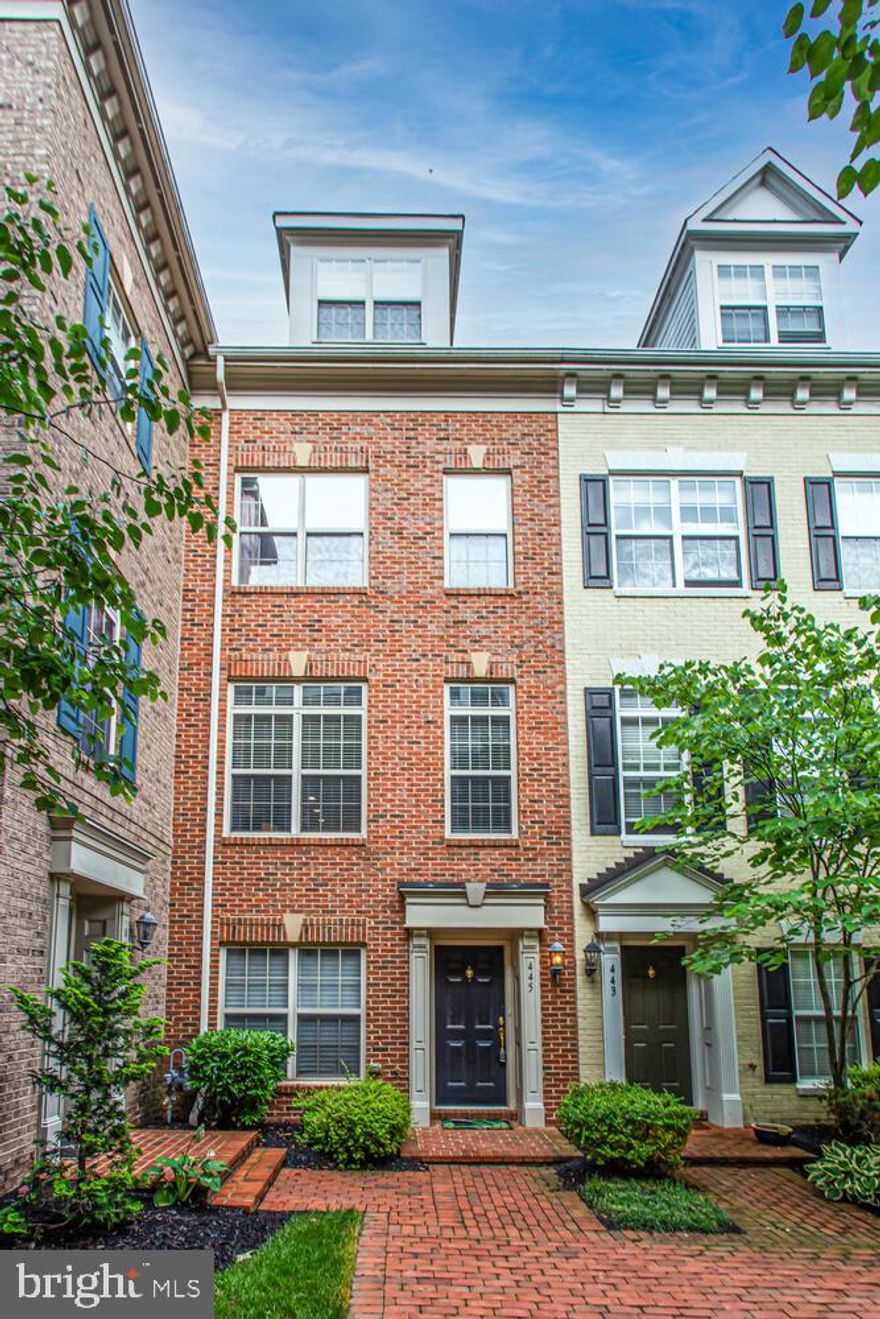 This property is located inside a gated courtyard, overlooking  beautiful landscaping. Open floor plan features hardwood floors, 10 foot kitchen island, generous dining area, separate oversized living / family area and half bath. The third level includes the primary bedroom, primary bathroom with separate shower and soaking tub, second bedroom, a full bath, linen closet and laundry area. 4th level boasts 2nd primary bedroom with attached full bath, steps to the rooftop terrace. The terrace has plenty of room for entertaining! Located less than a block from the bus stop and approximately 3 blocks to the Ballston Mall, entertainment, Metro station, shopping and restaurants.  Don't miss the Rec Center at Lubber Run. Parks, hiking and biking trails are close by. 2 spaces in the tandem Garage and 2 permits included for guests parking.