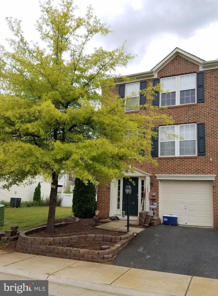 Beautiful end unit completely finished with bump outs. Offering 3BR/2BA and (2) 1/2 BA, spacious FR, LR, KI with breakfast area and dining room and a separate sunroom. Vaulted ceilings in MBR, full bath and walk-in closet, Corian counter tops, hardwood floors throughout main level, one car garage, kitchen island and so much more. Nearby restaurants, shopping and ideal for commuters.