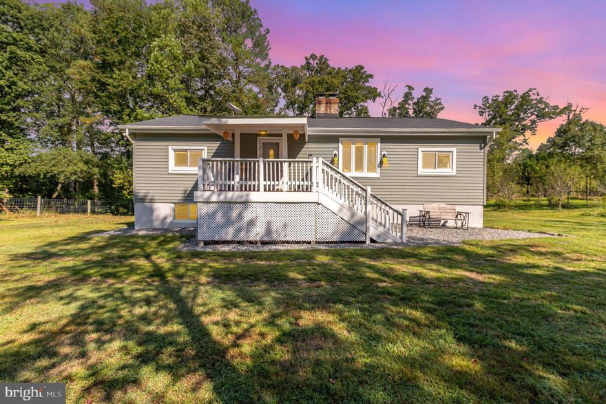 **Now Live! Ask about possible VA Loan Assumption**
Escape to your own private retreat on nearly 5 acres of fully fenced land, ideal for pets, livestock, or simply enjoying the wide-open space. This charming 2 bed, 2 bath home blends tranquil country living with modern updates, just minutes from town and less than 5 miles to the VRE commuter station.
The property boasts 34 fruit trees, high-tensile woven wire fencing with an inner/outer ring for separation, and trails perfect for ATVs, four-wheelers, or dirt bikes. A garage with electricity, lean-tos, and generator hook-up provides flexible storage and utility options.
Step inside to find main-level living with an open floor plan, a cozy brick fireplace serving as the centerpiece between the living and dining rooms, and a bright kitchen with abundant cabinetry and backyard views. The walk-out lower level, already plumbed with a bathroom rough-in, offers endless potential for workshop, recreation, or future finished space (property percs for 3 bedrooms).
Recent upgrades add peace of mind:
New HVAC & heat pump (2024, 10-yr warranty)
New water heater (2025, 6-yr warranty)
New sump pump (2023)
Water softener & 3-stage filtration system (2023)
New PEX water lines (2023)
Roof, siding, soffits, fascia, gutters (2022)
Septic system (approx. 2019/2020)
Additional features include a private drilled well (no waiver), Starlink high-speed internet, conventional septic with drainfield, and electric HVAC (no oil usage).
Enjoy quiet mornings on the covered front porch overlooking a park-like setting, or cozy evenings by the wood stove in the basement. Whether you’re seeking a small farmette, a hobby homestead, or just a peaceful retreat, this property offers the best of both worlds with serenity and convenience.