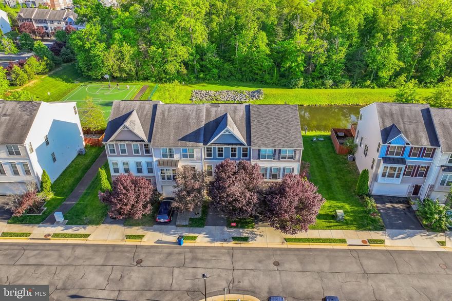 Just listed! Located  minutes from Brambleton Town Center, Broadlands shopping center, Metro station, Dulles Airport and so much more.   The large rec-room in on the entry level could be used as a 4th bedroom as it has a full bathroom on this level.  The kitchen  has hardwood flooring, gas cooktop, wall oven, microwave and refrigerator.   Off of the kitchen is a large trex deck that overlooks a pond and trees.   There are stairs from the deck leading to the patio below.   The primary bedroom has a walk in closet, large bathroom with dual sinks, soaking tub and separate shower.