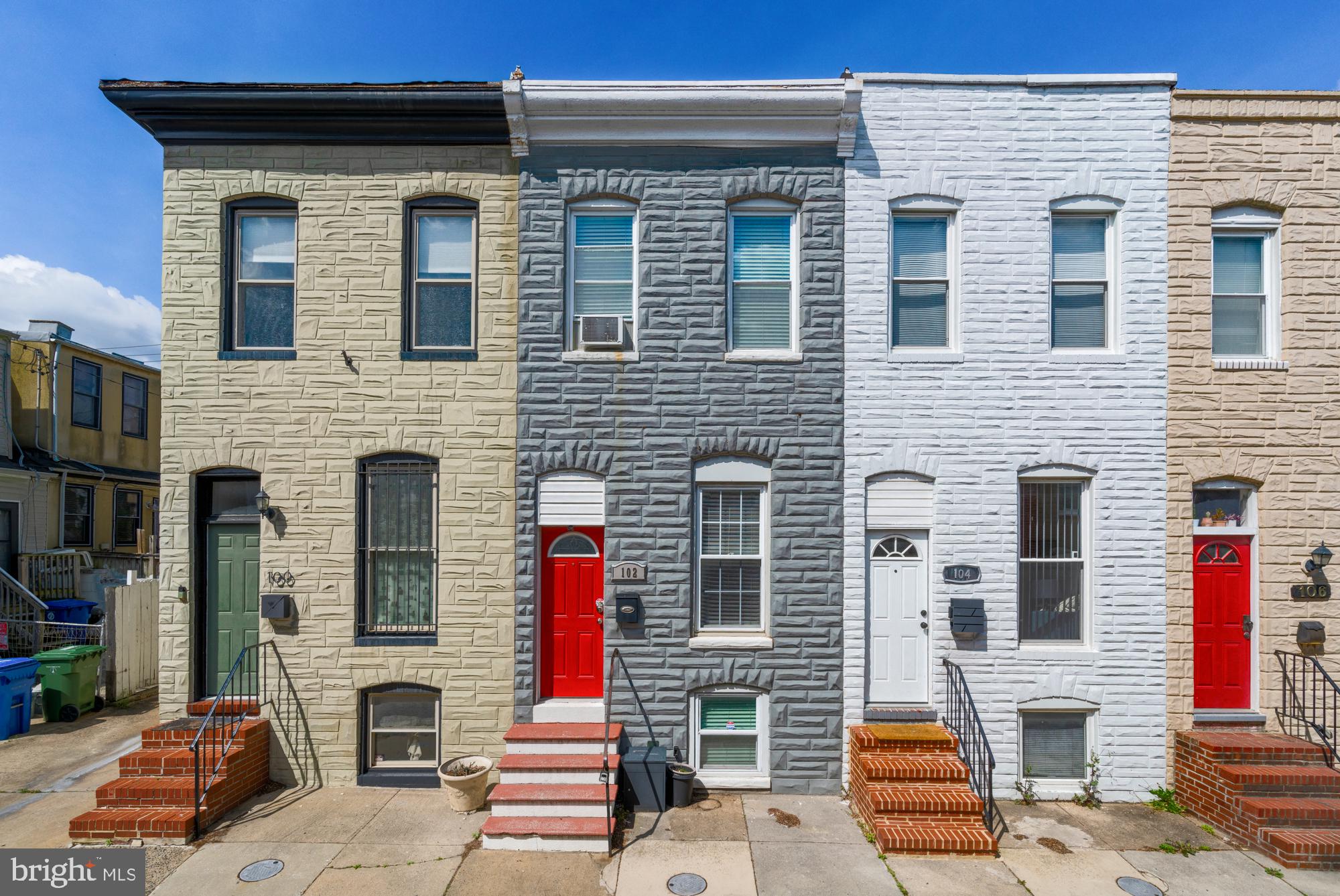 *All furniture is available for purchase.* Welcome to 102 N Glover Street, a beautifully renovated brick townhouse nestled just one block from the vibrant Patterson Park. This charming 3-bedroom, 2-bathroom home perfectly blends historic Baltimore character with thoughtful modern updates. Inside, you'll find an inviting open-concept layout with 9-foot ceilings, abundant natural light, and gleaming hardwood floors throughout. Providing 1,328 square feet of livable space, you'll have plenty of room for entreating guests, storage, and comfortable living. Crown and Box Moldings, as well as recessed lighting, add a touch of elegance throughout the home. The designer kitchen is a true showpiece, featuring custom white cabinetry, granite countertops, imported stone tile backsplash, and stainless steel appliances—ideal for both casual meals and entertaining guests. Both bathrooms have been tastefully updated with walk-in showers and stylish finishes, including a double vanity in the upstairs hall bathroom. The primary bedroom has a private west-facing deck, allowing you to enjoy relaxing sunsets from your bedroom or office.. A fully finished lower level offers flexible living space, whether for a home office, rec room, guest accommodations, or a family member who wants to have their own floor. Out back, enjoy a spacious rear patio perfect for hosting or relaxing, along with the convenience of an oversized private off-street parking pad—an incredible bonus in this neighborhood. All furniture is available for purchase, The Couch and Dining room table are luxury West Elm pieces. There is also a Roomba, Smart TV, and a Mesh Wifi Network System that includes 3 Wifi Routers synced together to give you fast internet no matter where you are in the house! Located in one of Baltimore’s most beloved communities, this home sits just one block from Patterson Park’s green spaces and amenities, which include a Rec Center, Basketball Courts, a Pool, and Trails. Just a few minutes walk from local dining, shopping, grocery, and coffee, and just 0.8 miles from Johns Hopkins Hospital and the Johns Hopkins Metro Stop. Just a few blocks off of Route 40 and Blue / Orange Link Bus Stops. 1.5 miles to the Inner Harbor / Downtown area, 1 mile to Canton, 1.3 miles to Fells Point. Whether you're a first-time buyer, seasoned homeowner, or simply looking for a comfortable and stylish space in the heart of the city, 102 N Glover Street is a must-see Baltimore gem.