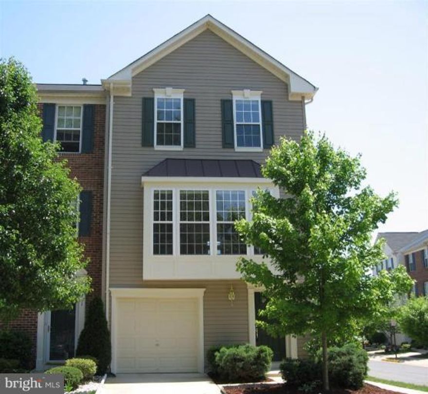 Lovely,  3 bdrm, 2.5 bath end TH w/garage. Light & bright.  Gleaming hardwood floors. Upgraded appliances, 42" oak cabinets. Three level bump-out. Nine foot ceilings. Wood blinds. Family room w/gas fireplace. Deck off of dining room. MBR w/walk-in closet, large soaking tub, separate shower, & double basins. Lower level walk-out. Fenced yard.