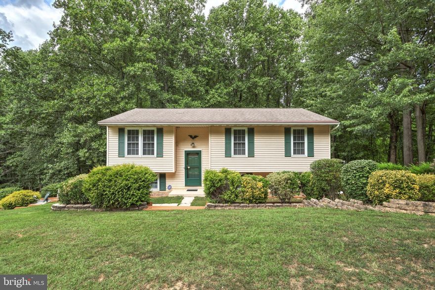 Welcome to 690 Arbor Dr. in Westminster This home is located 1 mile from the Pa/Md line and only 10 minutes from the hubbub of Westminster. The home has been lovingly maintained and improved by the present owner for almost 26 years. You'll love the well equipped kitchen that offers plenty of cabinet and counter space and updated stainless steel appliances. The kitchen opens to the cozy living and spacious dining rooms which all have crown molding. There is access through the Dining Room to the upper deck that runs the full length of the house.  There are 3 good size bedrooms with ample closet space and an undated shared full bath to finish this level. The lower-level is completely finished. The cozy family room is complete with a pellet stove that provides warmth on cold winter days, a fourth bedroom that could be used as a private office/craft room and an updated powder room for guests plus a laundry and utility room with a small chest freezer and storage cabinets.  There’s a large oversized detached two-car garage with unfinished interior waiting for that do-it-your-selfer to set it up the way they want. Don't miss out on this great house, in a great location with easy access to commuter routes  Some of the Other features included with this home are a whole house generator and gutter guard. The back of the house offers an expansive deck over a patio that both run the length of the house where you can enjoy the serenity of the park-like setting of the 2.38 acres or take a stroll through the mature trees to find a babbling brook along the back of the property.   So, If you have been looking for a piece of nature in the city here it is schedule your showing ASAP.