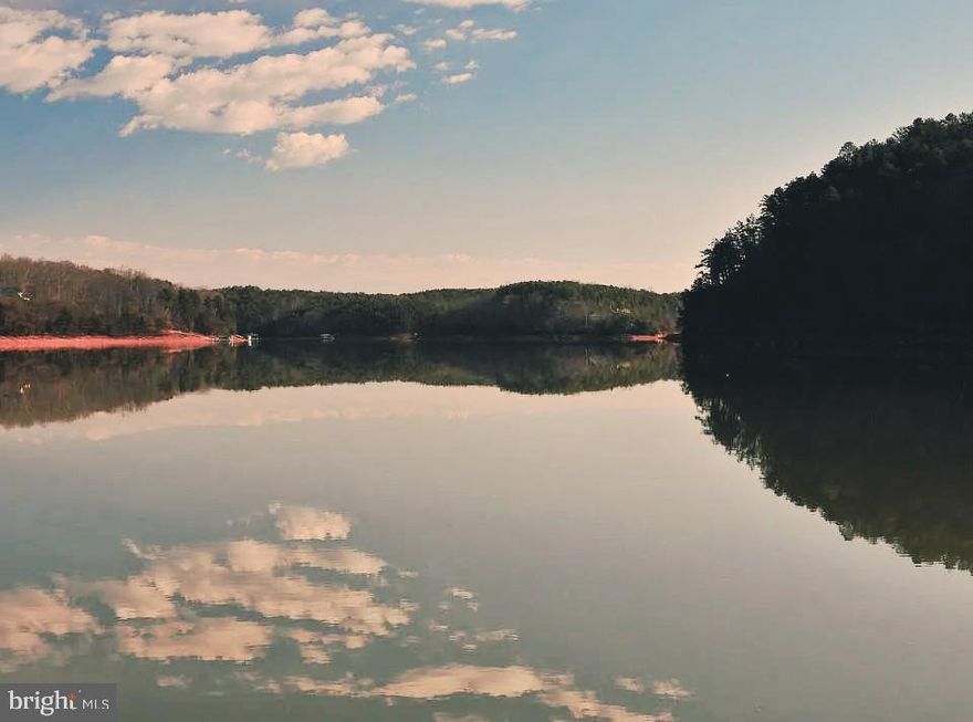 Exceptional Waterfront Opportunity in Runaway Bay

This stunning 2-acre waterfront property offers an impressive combination of natural beauty, direct water access, and outstanding community amenities. Positioned at the end of a quiet cul-de-sac, the lot provides privacy, scenic views, and direct access to the Roanoke River, with convenient boating access to Leesville Lake and close proximity to Smith Mountain Lake.

Enjoy picturesque lake and river views complemented by breathtaking mountain vistas—an ideal setting for a custom-built retreat or full-time residence. The waterfront feature is a true highlight, offering direct access to the river for boating, fishing, swimming, and relaxing by the water.

Located within the highly sought-after Runaway Bay community, property owners enjoy access to:

A private community dock with day-use slips and limited long-term slip availability

A gated community boat launch with secure access

Boat, trailer, and RV storage area

A waterfront pavilion available for private gatherings

Picnic areas

Tennis court with pickleball striping

The pavilion may be reserved for personal events, with HOA-sponsored events taking priority. There are lots of community events and Happy Hours!!  Long-term dock usage and pavilion reservations are coordinated through the Runaway Bay Property Management Company in accordance with HOA policies.

With its excellent value, prime waterfront location, and desirable community amenities, this property presents a rare opportunity. Bring your boat, fishing gear, swimwear, and building plans—this is your chance to create the waterfront lifestyle you’ve been waiting for. Opportunities like this do not last long.