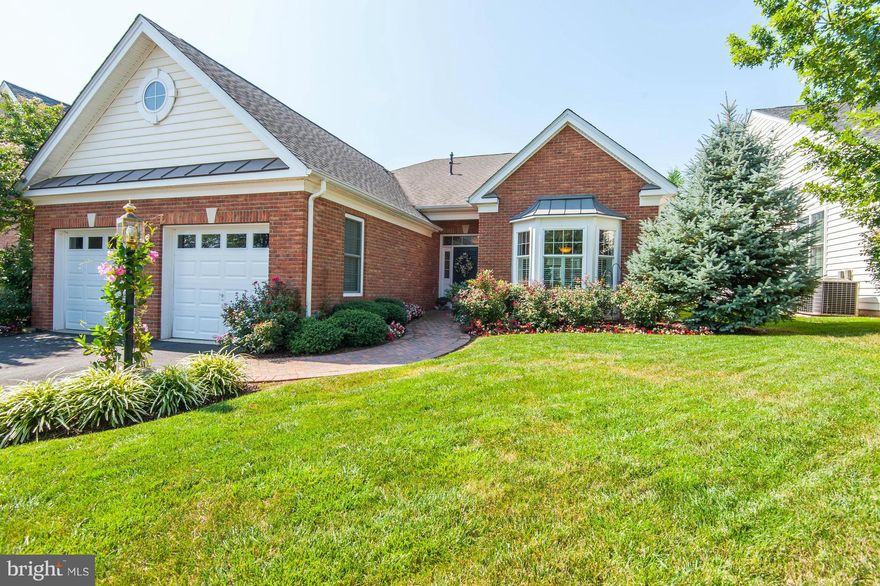 Beautifully maintained San Remo.  All the comforts of one level living.  Home is enhanced with brick paver walkway and lush plantings.  Screened porch with brick pavers  and brick paver patio.  Tasteful custom designer paint.  Beautiful hardwood flooring (no carpet), plantation shutters, bay window in kitchen, corner fireplace and library/office.  This home was loved and is waiting to love you.