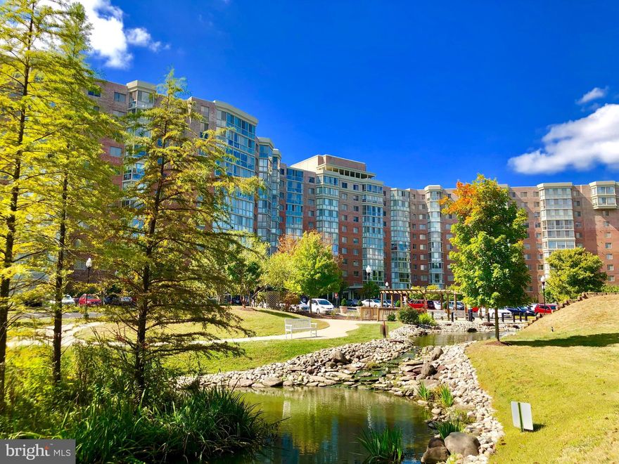 55+ Premier retirement community, popular “B” Model located in the Overlook. Updated 2 bedroom, 2 full bath condominium, with enclosed sunroom. Full of natural light. Updated kitchen features white cabinets, quartz countertops. Kitchen has a pass-through opening to the dining room. Primary bedroom with en suite bathroom, step in shower and walk in closet. Hardwood floors in the living and dining rooms.  New carpet in both bedrooms and the balcony. Lots of organized closet storage space.  Move in ready. Gas heat and central Air conditioning. Garage space #29, storage cage #70 in storage room P2. Enjoy all the amenities this community has to offer, golf, tennis, picklelball, swimming, and fitness center. Multitude of clubs and activities. Close to shopping and restaurants.