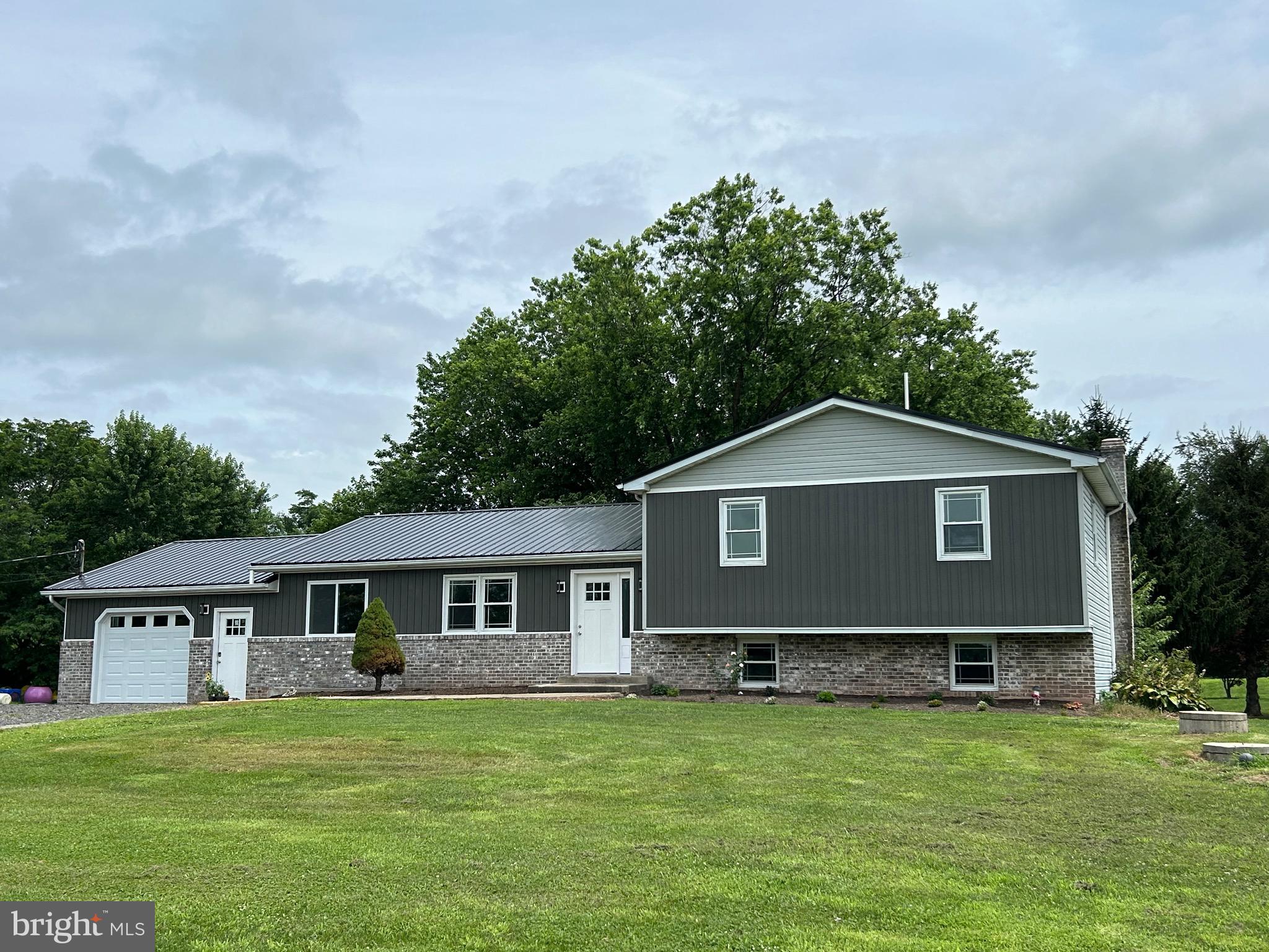 If a 3 bedroom, 2.5 bath home is what you are looking for, this is your new address! The fresh and clean split level was just updated and features a revised floor plan creating a more open concept layout. The center of the home has a fabulous kitchen with a grand center island. Also featured is a mini frige and service sink. The bonus room off the kitchen is a great place for a formal dining room , in home office with country views, or a play room for the kids. You can access the multi level deck from the sliding glass door in the kitchen. It is an ideal place to relax after a long day! LVP floors and carpeting are new and bare foot approved! Front door guests will enter into the spacious living room. Lower Level family room is ready for entertaining family and friends. Laundry room and 1/2 bath are conveniently located on this level. Primary bedroom has a walk-in closet and a primary bath that makes a real statement! Pole barn/garage has more than enough room for your toys, a workshop or a place to store a classic car! This is just what you have been waiting for!