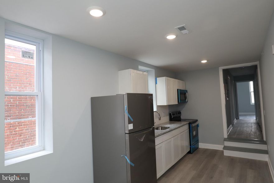 Welcome to a remarkable living experience in our recently renovated three-bedroom, one-bathroom apartment conveniently located near Temple University. This unit offers a perfect blend of style and comfort, featuring upscale upgrades that will exceed your expectations.

Step into the apartment and be greeted by luxury vinyl flooring, which spans throughout the entire unit, complemented by recessed lighting that creates a warm and inviting ambiance. The kitchen boasts elegant granite countertops and is equipped with sleek stainless steel appliances, giving the space a truly modern and sophisticated feel.

The bathrooms are designed with your relaxation in mind, featuring ceramic tile throughout and a generously sized bathtub where you can indulge in soothing soaks after a long day. Convenience is key, and this unit includes a large stackable washer and dryer to effortlessly handle all your laundry needs.

Ensuring your peace of mind, the apartment building is equipped with a contemporary electric keypad on the door, providing both easy access and enhanced security for your utmost convenience and safety.

In addition to its stylish features, this apartment also offers ample storage space in each of the bedrooms, allowing you to keep your living areas organized and clutter-free.

Don't miss out on this spacious and modern apartment that offers an exceptional living opportunity. Contact us now to schedule a viewing and secure your new home today.