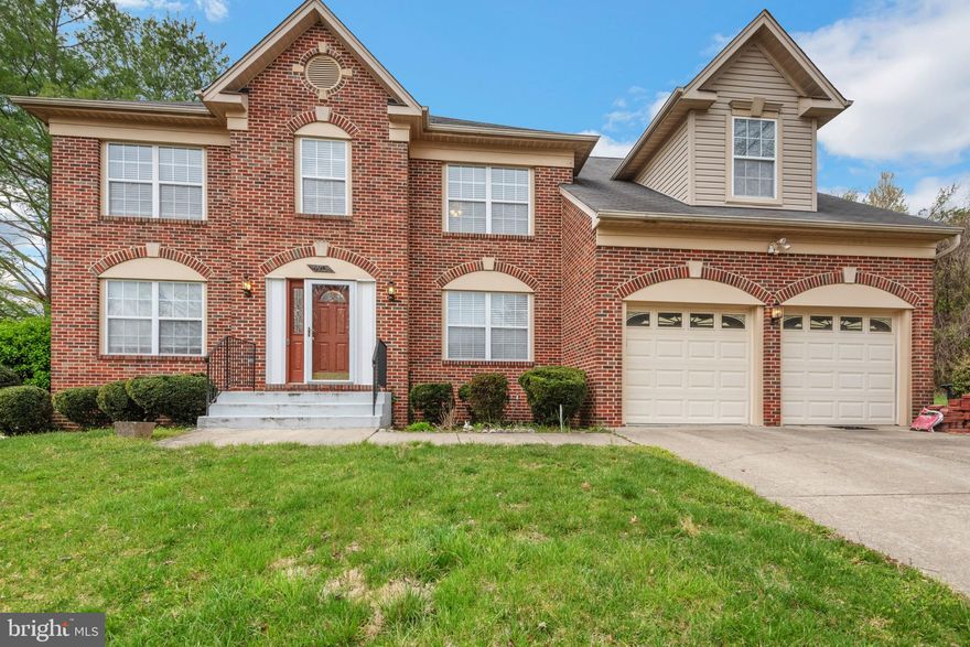 Welcome home to this beautiful brick front Colonial in sought after Windsor Park at the end of a quiet cul-de-sac! Plenty of room to grow in this 5 bedroom, 3.5 bath home with over 4,500 sq ft of space and .3 acres of land! Beautifully landscaped with foundational bushes, spacious front lawn, and a walkway leading to your front door. Enter into a welcoming foyer that features a half bath, coat closet, and hardwood floors that flow into the kitchen and family room. The light and bright living room features crown molding, large window, and plush carpeting that flows into the formal dining room. You'll love the wall of bay windows and additional window letting in streams of light while you entertain guests easily under a 5 light chrome brushed chandelier. The spacious kitchen features plenty of cabinet and counter space, track lighting and double sink with detachable faucet and window view. Also features all stainless steel appliances, including a triple door fridge with ice maker and pull out freezer. Enjoy everyday meals in the neighboring breakfast nook with a peaceful view into the backyard from the sliding glass doors. Relax in the nearby family room that features a cozy wood burning fireplace with mantel, as well as a cooling ceiling fan! Take the stairs to the upper level and extra spacious main bedroom that features a a separate en-suite and includes a soaking tub, stall shower and dual sink vanity. Four bedrooms and a hall bath complete the level. The walk-up basement features recessed lighting, tile flooring, wet bar with bar stool seating, and plenty of space for a rec-room, home gym and additional storage space. Also includes the 3rd full bath. Enjoy the outdoors in your backyard that backs into trees and features a shed for tool storage and a concrete patio - the perfect place for a summertime BBQ! Plenty of space to part with the attached two car garage and paved driveway. Near multiple shopping and dining destinations and easy access to Joint Base Andrews, and 495. You do not want to miss this one!