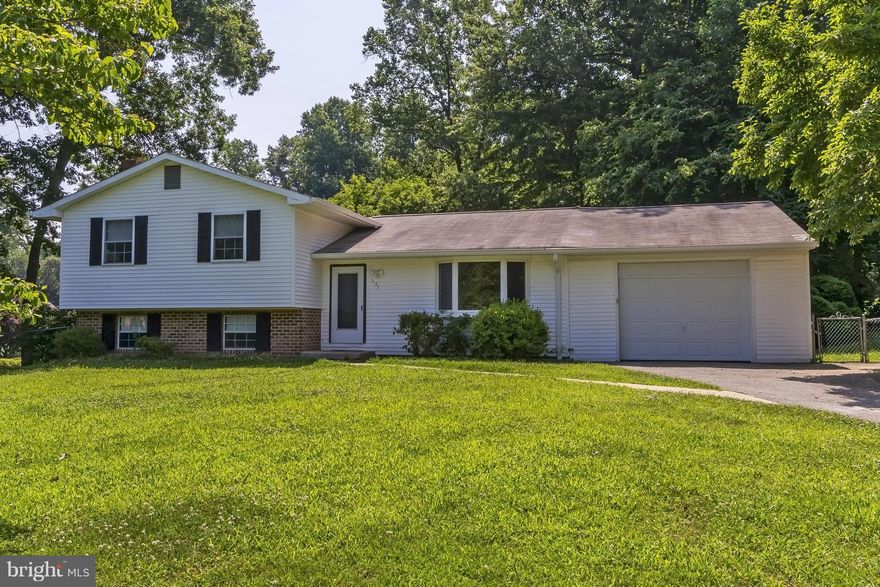 3 bedroom/2 bath home with garage in sought-after community.  The largest, corner-lot property in the neighborhood - just under one acre. Kitchen with breakfast room. Large family room w/ woodstove. Gas Heat. Plenty of space for storage or additional/bedroom. Multi-level decks. Needs updating, but great home. Neighborhood elementary. Near Downtown Annapolis, shopping & Rts 50&97.