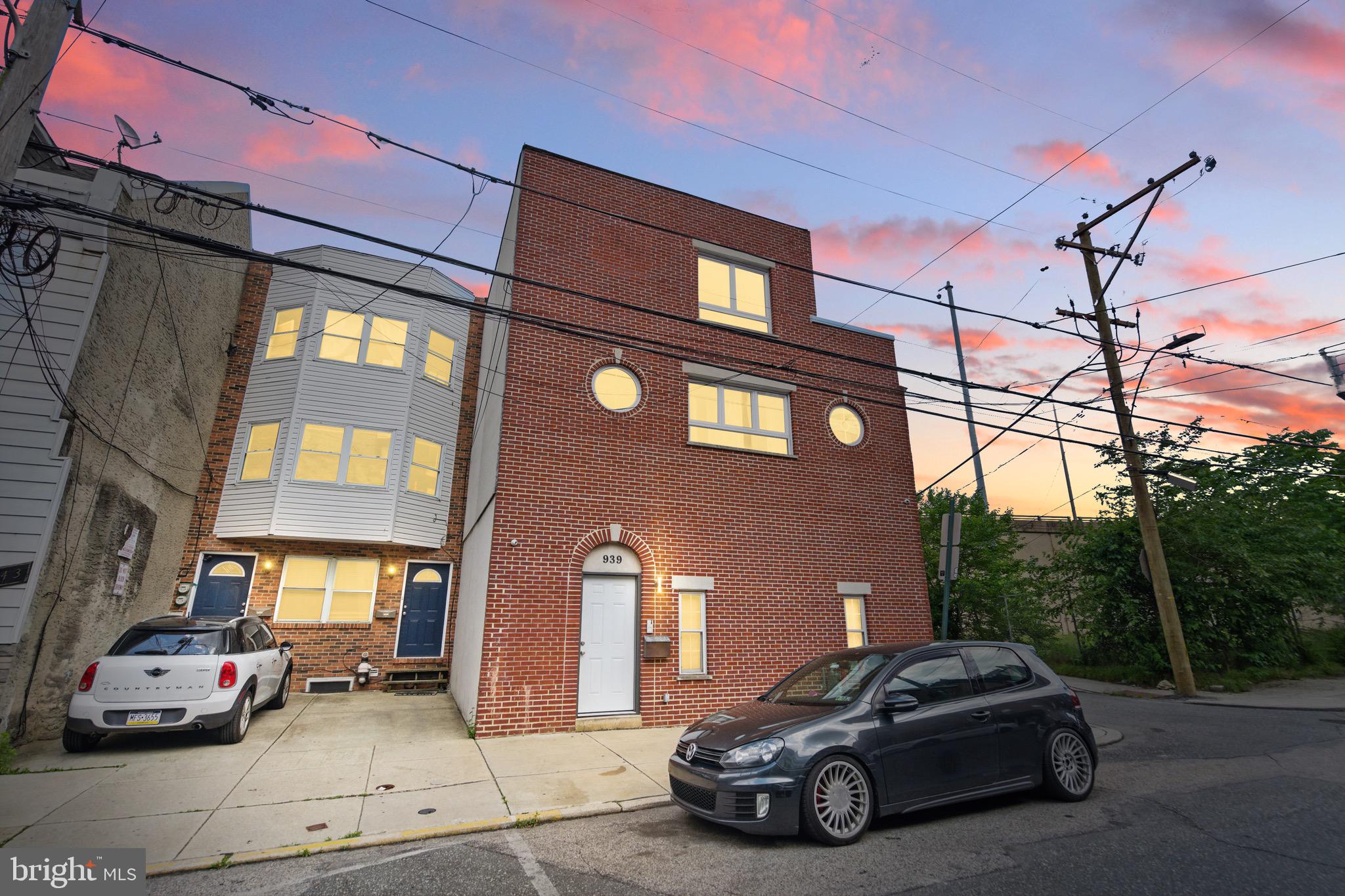This is the hidden gem opportunity that you’ve been waiting for in the heart of Northern Liberties! Worried about parking? Not anymore. This property offers an oversized 2 car garage with a drive way that can fit up to 2-3 cars. Step inside to find a luxurious 3-bedroom, 2 full bath-2 half bath residence. This home is packed with high-end features and a layout designed for versatility—including a finished basement ideal for a kids play room, office, or home theater. Enjoy an elegant first-floor guest suite with a private full bathroom, followed by an open-concept second level that flows into a glass-railed outdoor deck. The designer kitchen stuns with quartzite stone, Viking appliances, 6-burner range with griddle, 4 ovens (2 double ovens, 2 with the stove), oversized fridge, and ample storage space. Truly a chefs dream! The primary suite features double closets, a spa-inspired bath with onyx finishes, heated towel rack, Jacuzzi soaking tub, and a private balcony. Additional bonuses are surround sound speakers throughout, tankless water heater, central air conditioning with additional split-zone in the bedrooms on the third floor, HVAC, heated tile flooring in the basement, and custom iron railings throughout. Additionally, the walk score is 93! You can easily walk to Old City, Fishtown, Center City, the Delaware River Trail, Laser Wolf, Café La Maude, The Kettle Black, La Colombe, Middle Child, Del Rossi’s, WM Mulherin’s, Orianna Hill Dog Park, City Fitness, and more! Lastly the seller is offering up to 10K seller assist!