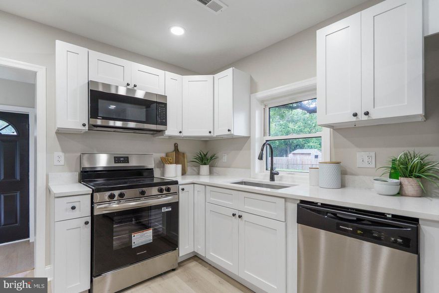 ***HUGE PRICE IMPROVEMENT - FREE FLAT SCREEN TV WITH FULL PRICE OFFER & THAT CLOSES BEFORE END OF THE YEAR!*** One of the most adorable &  competitively priced single family homes in AA Co., this newly renovated 2BR/1BA Rancher located on a fenced in corner lot in the quiet neighborhood of Arundel Gardens has so much to offer.  Make your way through the gated front yard under the covered front porch and through the door into your new home!  Not only is the home boasting with natural light, it offers luxury vinyl flooring, brand new appliances, new recessed lighting, and more!  The main living space features an open concept design for the dining area, kitchen, and living room.  The kitchen is equipped with an abundance of soft close cabinets, stainless steel appliances, and quartz countertops. Off the main living area is a spacious primary bedroom, a sizable secondary bedroom, and a newly remodeled full bath.  From the breakfast room step outside to a yard filled with green space, a spacious shed, large parking pad, and so many possibilities!  This home is move-in ready with so much to offer new homeowners, and is located in close proximity to schools, gas stations, shopping, restaurants, and only minutes to commuter routes like Gov Ritchie Hwy, 895 & 695. In this community there are play new and beautiful playgrounds and basketball courts for the public. Come and check it out today!!