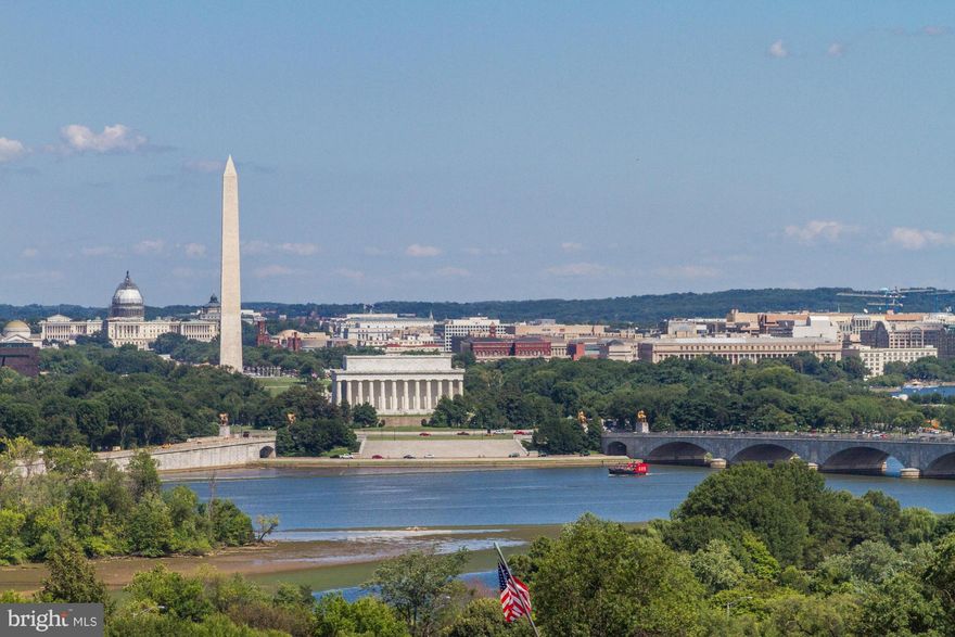 Spectacular views of the Washington Skyline, Potomac River, Monuments, and more, are abundant from this impressive Federal Style TH with private roof deck on the highest elevation of the Monument Place complex.  Gourmet Kitchen with Sub-Zero / Viking appliances, Open Floor Plan. 5 levels w/ Elevator. 2-Car Garage.  Only moments to Georgetown, Downtown DC, the Pentagon, and Reagan National Airport.