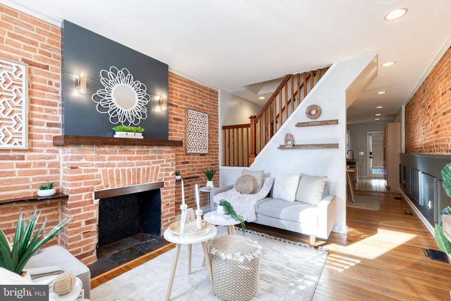 Exceptional Properties. Exceptional Clients.
OFF-STREET PARKING & ROOFTOP DECK! Welcome to 440 E Clement Street, a beautifully maintained 2-bedroom, 1 full and 2 half bath Federal Hill home offering classic charm and modern convenience. The main level features gleaming hardwood floors, exposed brick walls, a living room, and dining area flowing into a well-appointed kitchen with a granite breakfast bar & countertops, ample cabinetry, and direct access to the private parking space, plus a convenient powder room. The upper level offers two bedrooms, a full bath, and access to the rooftop deck—showcasing panoramic city views highlighted by the iconic Domino Sugar sign, perfect for entertaining or unwinding outdoors. The lower level adds valuable living space with a bonus recreation room, laundry area, and an additional half bath. Ideally located just steps from Riverside Park, shopping, dining, and with easy access to I-95 and I-695 for commuters.