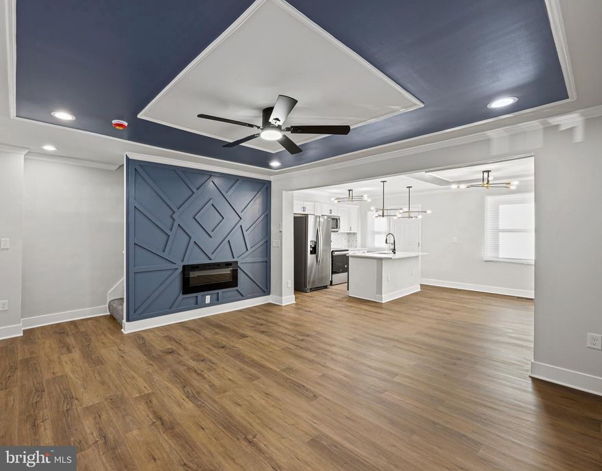 Welcome to this stunning custom renovation that you're sure to fall in love with! Step in to the open concept main level with tons of natural light. . You are greeted with the spacious living room highlighting the coffered ceiling detail and elegant lighting. The kitchen is the star of the show with custom backsplash, modern counter tops, luxurious gold finishes, and brand new stainless steel appliances. Off of the kitchen you are able to access the rear yard which is the perfect space to create your own private oasis. Upper level features three carpeted bedrooms and a stylishly renovated full bath. Lower level also includes laundry, half bath, and walkout steps to the rear yard. Make your appointment today to experience all this property has to offer!