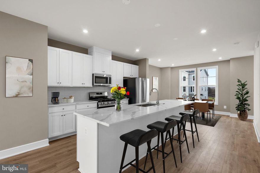 Say hello to your new home! This brand-new TOWNHOME is ready for you to move in IMMEDIATELY! Step into contemporary luxury with the captivating NICHOLSON floorplan by Van Metre Homes at LAKE FREDERICK. Spanning 2,149 finished square feet across three meticulously crafted levels, this exquisite townhome offers an unparalleled blend of style, comfort, and convenience. Boasting three bedrooms, three full and one half bathrooms, and a convenient 1-car front load garage, this residence is designed to exceed expectations at every turn. As you step inside, you're greeted by a meticulously crafted living space adorned with 9' ceilings, where the main level showcases a sprawling great room and dining area, seamlessly connected to a captivating kitchen featuring a central island, upgraded cabinets, tile backsplash, quartz countertops, and luxury vinyl plank flooring – the epitome of modern elegance and functionality. Venture to the upper level and discover a haven of relaxation in the impressive primary suite, complete with a generous walk-in closet and a luxurious 4-piece bathroom boasting double sinks and a frameless shower with a built-in seat – the perfect retreat after a long day. This level also hosts two additional bedrooms, another full bath, and a convenient upstairs laundry room, offering unparalleled convenience and comfort. Venture to the ground level and find a versatile multipurpose rec room and yet another full bath, providing ample space for relaxation and entertainment, with easy access to the private rear backyard, ideal for outdoor gatherings and leisure. Being a new build, your home is constructed to the highest energy efficiency standards, comes with a post-settlement warranty, and has never been lived in before! Don't miss out on this incredible opportunity to own a home that seamlessly combines modern luxury, thoughtful design, and a prime location, all at an unbeatable price. Schedule your appointment today! ----- Discover Lake Frederick, a charming community tucked in the serene Shenandoah Valley between Winchester and Front Royal. With its selection of townhomes and villas, Lake Frederick creates a perfect harmony between easy access to the great outdoors and a laid-back lifestyle centered around enjoying time with friends and having fun. With breathtaking mountain views just outside your door, this community boasts outstanding lifestyle amenities, including an award-winning farm-to-table restaurant, a community pool and clubhouse, tot lots, and miles of walking trails. End your days with family and friends while watching the sun set over the Blue Ridge Mountains. Moreover, Lake Frederick is conveniently located minutes away from major interstates like I-66 and I-81, ensuring seamless connectivity to the region. Embrace the sun-drenched life and the joys of natural beauty at Lake Frederick, where an exceptional community experience awaits. ----- Take advantage of closing cost assistance by choosing Intercoastal Mortgage and Walker Title. ----- Other homes sites and delivery dates may be available. ----- Pricing, incentives, and homesite availability are subject to change. Photos are used for illustrative purposes only. For details,  please consult the Community Experience Team.