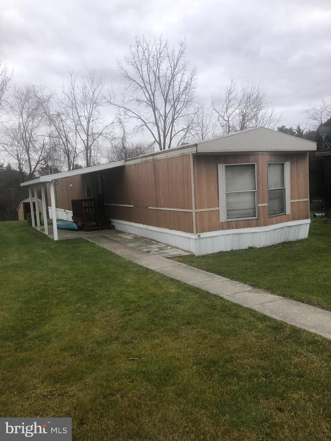 Three bedroom, two bath mobile home with covered patio and two storage sheds. All appliances convey. Buyer must be approved by mobile home park! Being sold AS- IS.