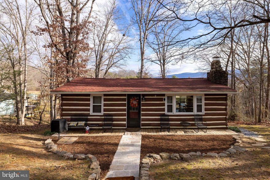 Welcome to 330 Mountainview Dr., Luray, VA — a charming 2-bedroom, 1-bath cottage perfectly positioned in the heart of Virginia’s Cabin Capital.

This delightful retreat is an active short-term rental, generating an impressive $50,000 in average annual revenue, and it conveys fully furnished and turnkey, ready for immediate STR operation or personal use.

Just minutes from the Shenandoah River, multiple public boat landings, and the renowned Shenandoah River Outfitters, this location is a dream for outdoor enthusiasts and vacationers alike. Whether guests are seeking river adventures, peaceful mountain views, or a cozy escape, this cottage offers it all.

Step inside to enjoy beautiful views from every window, creating a sense of serenity throughout. Outside, relax on the screened-in porch, unwind in the waterside shelter, or simply take in the sweeping surroundings that make this property truly special.

Opportunities like this don’t come often—this property will not last long.
Call today to schedule your private showing!