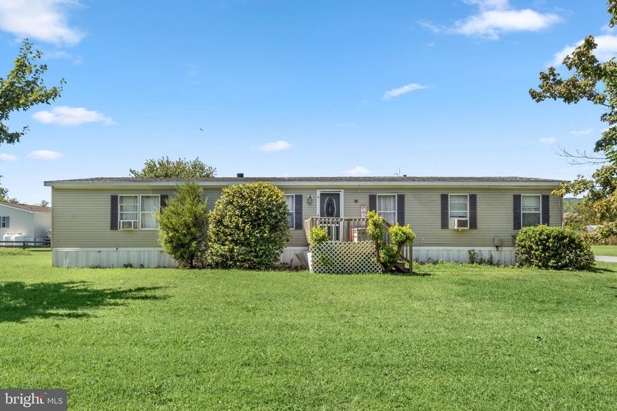 Welcome to 35310 6th Street in the waterfront community of Bay City, Millsboro! This spacious 4-bedroom, 2-bathroom home offers single-level living with a functional floor plan designed for both comfort and convenience. The layout features a bright living room, a large eat-in kitchen, a separate dining area, and a dedicated laundry room. The primary suite includes an en-suite bathroom, while three additional bedrooms provide plenty of space for family, guests, or a home office.

This property offers front and back decks, perfect for enjoying your morning coffee or evening relaxation. Bay City residents enjoy water access via the pier and boat dock, sport courts, and playground - plus it is just a short drive to the Delaware beaches, shopping, and dining.