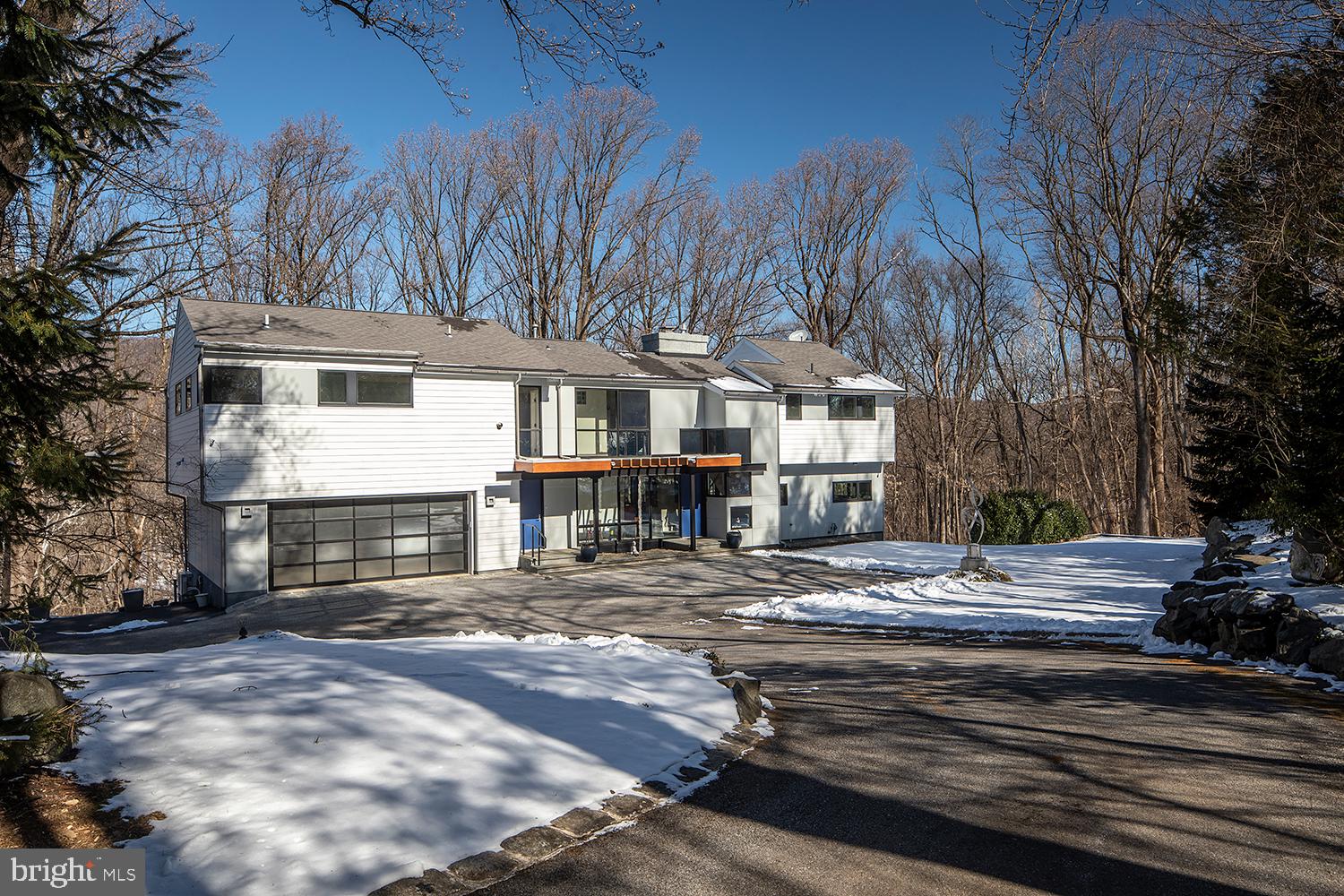 Tucked away at the end of a quiet cul-de-sac on a private 2.4-acre wooded lot sits this gorgeous, fully remodeled, contemporary home.
The first floor is open and inviting with modern features and incredible flow. Enjoy time with friends & family in the oversized family/dining and kitchen area, with stunning windows and skylights that frame the seasons & fill the space with natural light. The family room has a gas fireplace and access to the incredible rear deck that overlooks the Valley Stream, which bisects the property, and Valley Forge Mountain in the distance. Nearby the open kitchen is equipped with state-of-the-art, stainless steel appliances, new countertops, a breakfast bar & a large pantry. Also on this floor is a cozy home office/den with amazing views of the wooded grounds.
Upstairs there are 3 spacious bedrooms and 3 recently remodeled full baths. This includes an incredible suite with a private bath, sitting room, cathedral ceiling, private deck, fireplace, walk-in closet, and separate access, which could be suitable for a luxurious owner or in-law suite.
The finished lower level has plenty more to love with a gym or 4th bedroom, full bath, playroom and wine cellar with natural wood accents. There is also an oversized family room with a walkout to the gorgeous outdoor space where the new buyers can cook s'mores in the fire pit, sit on the rear deck and relax with a glass or wine or walk the trails.
With the Cool Valley Nature Preserve right in your backyard and Valley Creek Preserve nearby, 2301 Pheasant Hill Lane allows you to enjoy the peace and tranquility of being surrounded by nature while at the same time a great family home and perfect for entertaining. The house is not in a flood zone. All this conveniently located and in the award-winning Tredyffrin-Easttown School District.