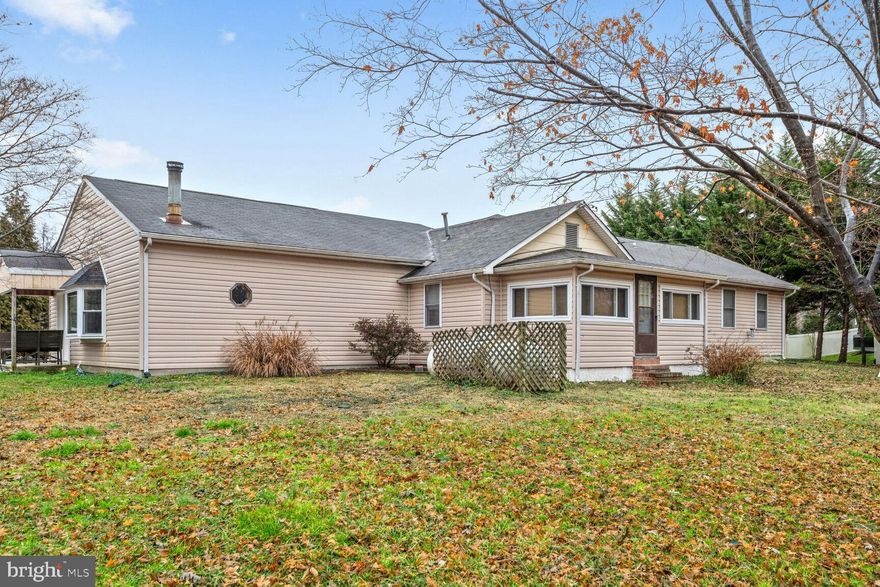 ONE LEVEL LIVING AT ITS FINEST PLUS CAR BUFFS DREAM GARAGE! Detached 3+ car garage (approx 35'x28') with half having 16' ceilings, perfect for all your toys! The house offers everything you are looking for in your next home! Large 23'x31' family room with new LVP flooring & freestanding corner wood stove perfect for those chilly winter nights. Gourmet kitchen featuring state of the art GE Cafe appliances, granite countertops, custom cabinets & a center island.  Vaulted ceiling primary suite has walk in closet, pellet stove & en suite bathroom w/ double vanity, shower & soaking tub. Slider leading out to deck/ your backyard oasis! Private backyard with screened in porch & your very own saltwater gunite in ground pool w/ 9' deep end. Above the detached garage you will find additional living space with a full kitchen and bathroom-tons of opportunity here to use it as you wish!  Just a short drive to Mayo Beach & Beverly Triton Parks