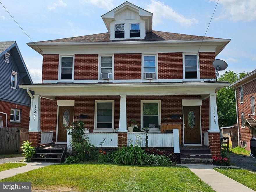 Large brick duplex.  NO CITY TAXES.  17409 side  consists of 3 bedrooms, 1 bath, living room, dining room, kitchen, full unifinished attic, and full unfinished basement.  17409 1/2 side consists of 3 bedrooms, 1 bath, living room, dining room, kitchen,  full unfinished attic, and full unfinished basement.  New gas furnace in 2022 for the 17409 1/2 side.  Conveniently located near shopping, restaurants, and other amenities.  Near I70 & I81 for commuting.