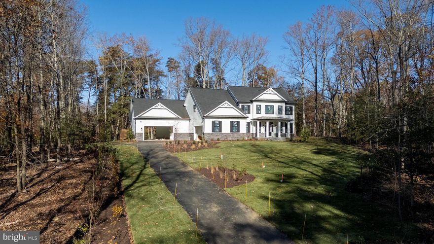 Discover an unparalleled opportunity to own a piece of paradise at 522 Ferry Point Road, a stunning new construction home nestled on 3.37 acres of secluded private land at the headwaters of Crab Creek. Enjoy the perfect balance of seclusion and convenience, with downtown Annapolis and major highways just a short drive away. This exceptional property, currently under development by the renowned Sturbridge Homes, offers a harmonious blend of luxury living and natural beauty in Anne Arundel County. Indulge in over 4,200 square feet of meticulously designed living space, featuring 6 bedrooms and 5 full bathrooms. Experience the pinnacle of luxury with a gourmet kitchen boasting luxury KitchenAid stainless steel appliances and elegant quartz countertops, sophisticated craftsman trim package, premium Andersen windows offering breathtaking views of the surrounding landscape, and a cozy gas fireplace.  The home offers additional premium amenities such as a movie theatre room, basement wet bar, two separate two-car garages (one oversized which can accommodate a variety of vehicles). Also included is a comprehensive smart home package that offers convenience, security, and efficiency with a state-of-the-art alarm system with strategically placed control panels, seamless garage door integration, intelligent lighting control, advanced HVAC control for optimal comfort, and smart lock integration. This rare new construction opportunity combines the allure of a secluded natural setting with the sophistication of modern luxury living. Although the home is on Crab Creek, there is not currently enough water depth to accommodate a boat, but still has ample shoreline to facilitate other water-oriented activities. Don’t miss the chance to immerse yourself in the breathtaking landscape and envision your future in this exquisite home. Contact us today to arrange your private tour and witness the stunning surroundings that make this property truly exceptional. Please do not drive down the driveway without an appointment as this is private property and is currently a construction site.