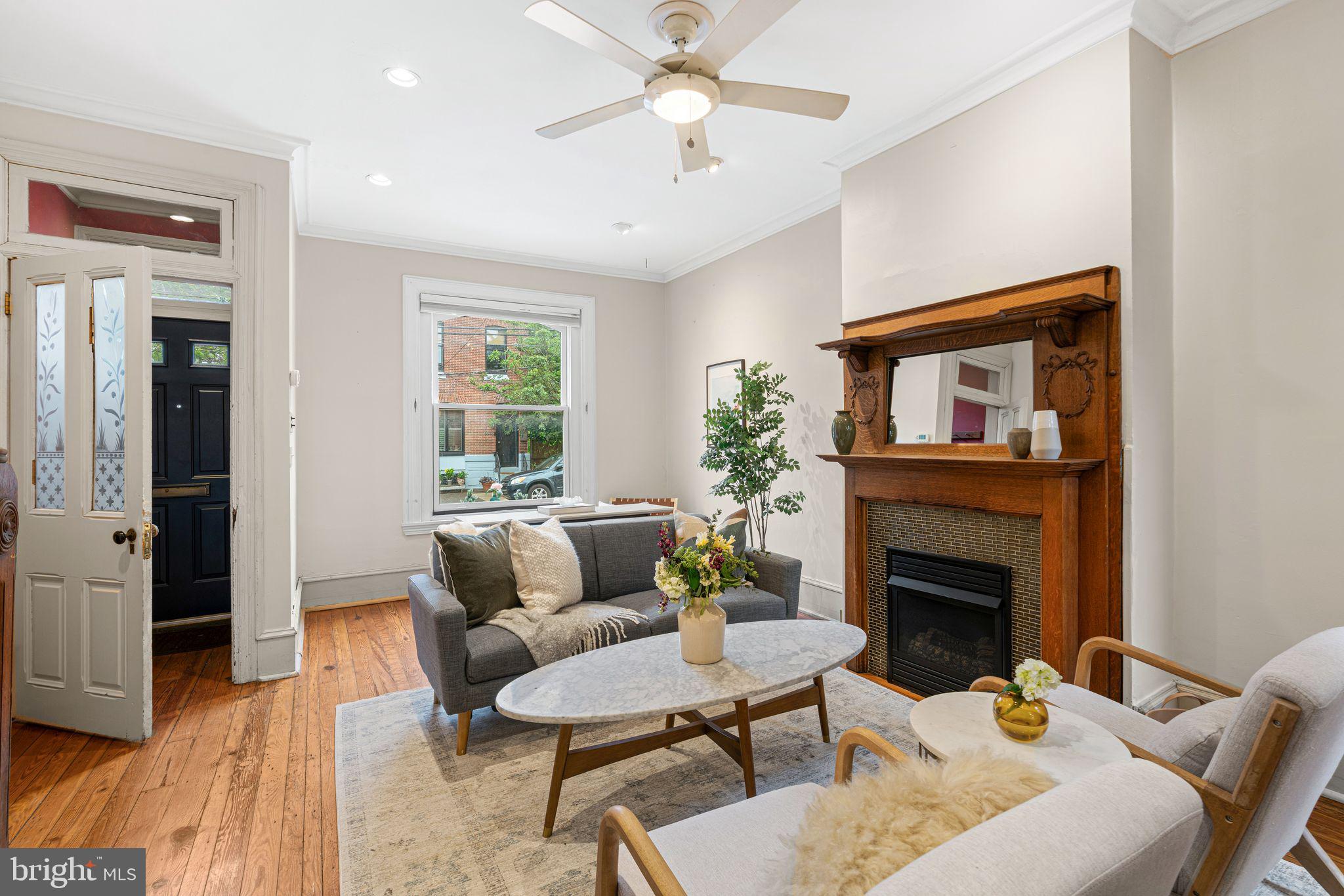 Welcome to 3015 Poplar Street—a delightful 3-bedroom, 1.5-bathroom Victorian-style townhome nestled in the heart of Philadelphia’s vibrant Art Museum Area. Built in 1925, this 1,128 sq ft residence seamlessly blends historic character with contemporary updates.
Step into the inviting living room, featuring high ceilings, refinished hardwood floors, and a decorative fireplace. The open floor plan flows effortlessly into a separate dining room, perfect for entertaining. The spacious kitchen boasts retro-inspired cabinetry that adds a unique touch of personality, complemented by a convenient half bath on the main floor.
Upstairs, you’ll find three sunlit bedrooms, two of which are large enough to be considered the master, with gleaming hardwood floors, offering ample space for relaxation and personalization. The back bedroom features a new hatch skylight that allows for roof access. The full, unfinished basement provides abundant storage options, while the rear patio serves as an ideal spot for outdoor gatherings and barbecues. There is efficient radiator heating throughout and three efficient European-style air conditioning units to cool the highest-volume rooms in hot weather.
Situated practically on the dividing line between Fairmount and Brewerytown, on the last block of Poplar Street before the Schuylkill River, the house is located just steps from Lemon Hill (part of Fairmount Park) and the Schuylkill River Trail, and a short walk from the Philadelphia Museum of Art, two grocery stores, and an array of local cafes and shops. Also having excellent access to public transportation (7, 15, 32, 48, 49 all within two blocks), this home offers the perfect balance of city living and neighborhood charm.
Don’t miss the opportunity to make this distinctive property your own!