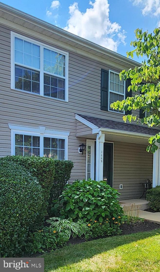 Welcome to 3648 Nancy Ward Circle. This 2 bedroom 1.5 bath townhome is in the sought after Patriots Ridge development. A Bright and sunny living room with new carpet greets you as you walk in. This spacious room has access to a closet, powder room and opens up into the Dining room with wood floors and access to the beautiful courtyard that has been meticulously maintained by the residents! This peaceful retreat is right out your sliding doors for you to enjoy your morning coffee or just to read a book. The kitchen has wood cabinets and tile floors with Stainless stove and refrigerator. On the second floor there are two good size bedrooms that share the full bath- both rooms have new carpet. The main bedroom has a large walk in closet with custom shelving and double windows overlooking the courtyard and the 2nd bedroom also has a good size closet. The lower level is mostly finished with a large family room/office/playroom, storage closet and plenty of recessed lighting. There is a laundry area with washer and dryer and lots of storage in the unfinished area. Enjoy living here with great access to downtown Doylestown and Dublin center shopping, near by Peace Valley Park, the tile works and mercer museum and tons of resturants!
