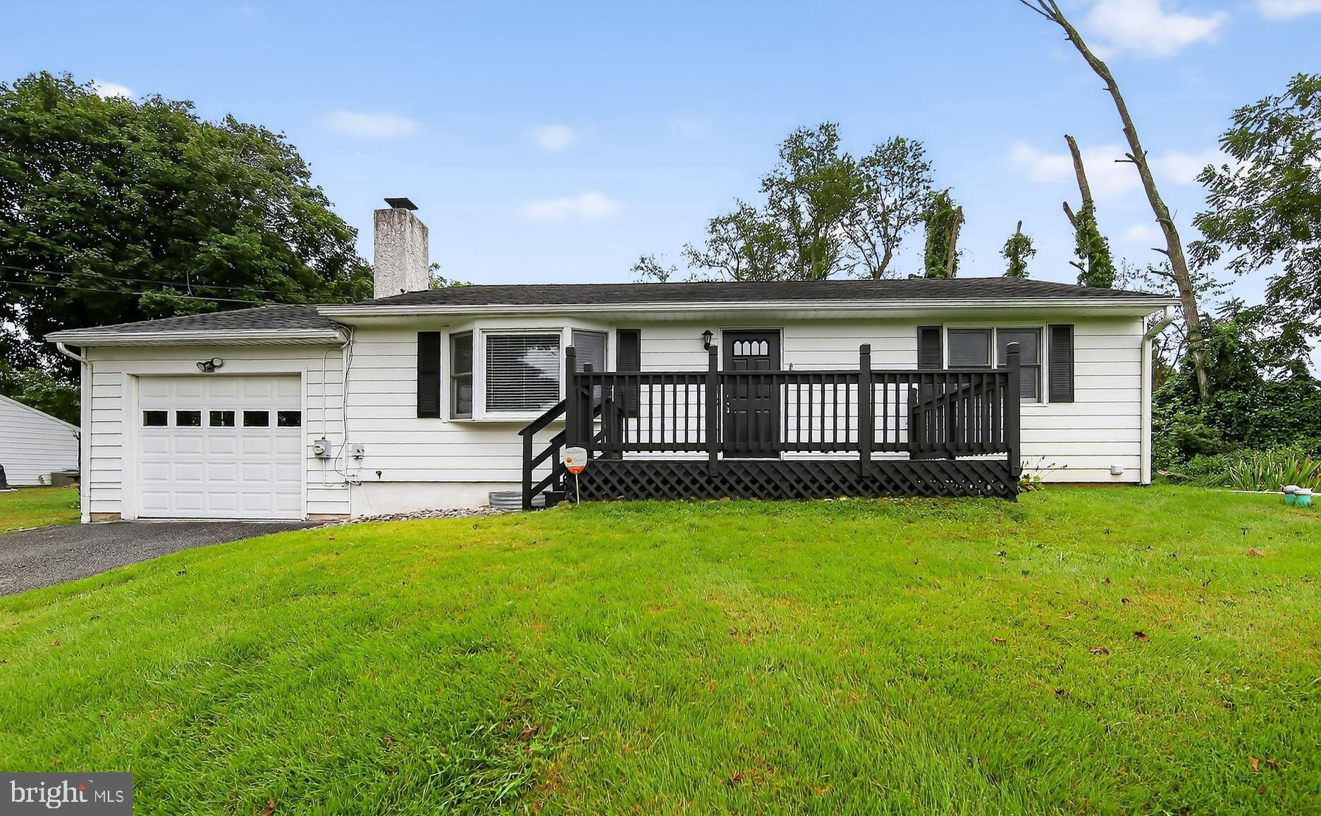 Welcome to your new ranch-style home, built in 1962, offering charm, comfort, and modern convenience. Step inside to discover a warm and inviting atmosphere in the 1066 square foot main level, highlighted by hardwood floors and an abundance of natural light streaming through the bay window and French double-pane patio doors. The eat-in kitchen features upgraded countertops and stainless-steel appliances, making it an ideal space for culinary creativity and casual dining. Gather around the massive stone wood-burning fireplace in the living room, creating a relaxing setting. Recharge in the three cozy main-level bedrooms. The main-level full bathroom is designed for both functionality and style. Enjoy outdoor living on the front deck, rear patio, in the yard spaces, perfect for entertaining or simply unwinding in the fresh air. The partially finished basement space offers a bathroom with stall shower and more. You will find the laundry is also in the lower utility room. Recent improvements include a new hot water heater 8/2025 and new carpet in basement 8/2025. Other features include an active radon mitigation, basement drainage with sump pump. Parking is a breeze with a front entry attached garage with door opener, accessible from the interior and rear yard and don't forget the ample driveway space. This home is not just a place to live; it's where memories are made. Experience the comfort and charm that this delightful property has to offer. Located in the bucolic Piedmont Region of Pennsylvania, Chester County, Upper Uwchlan Township and Downingtown Area School District. Convenient location to access the PA Turnpike, dining and shopping in the Village of Eagle, and Marsh Creek State Park quickly by car. Come enjoy this home and make it your own!