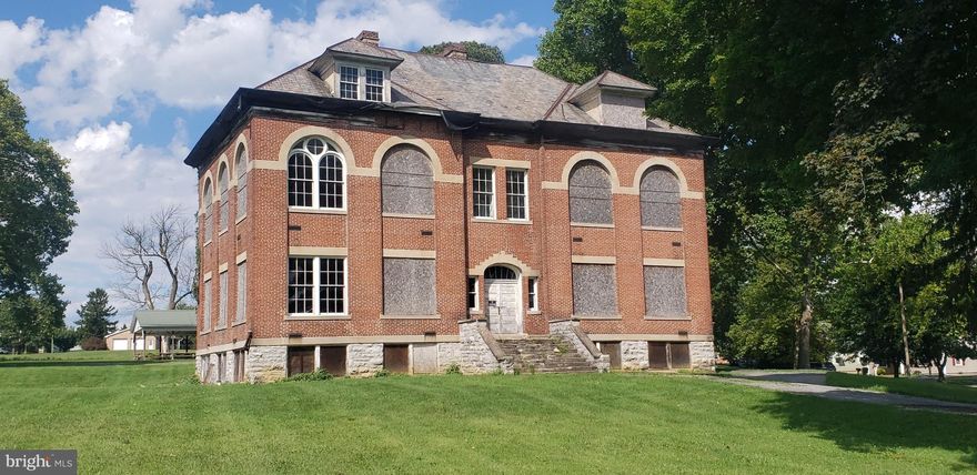 THIS LISTING IS THE FORMER ZULLING SCHOOL. ZONING IS R1, SINGLE FAMILY RESIDENTIAL, All ALL CONTRACTS TO BE IN BY FRIDAY, 8/25 4PM!   
THEREFORE NOT LIST IN COMMERICAL PROPERTIES.  ZONING MAY BE ABLE TO BE CHANGED WITH A REQUEST FOR A ZONING CHANGE BY WASHINGTON TOWNSHIP AS PROPERTY ON CORNER OF WHARF ROUTE AND ROUTE 16 IS COMMERICAL AND TO THE REAR ZONING IS R-2. CONTACT WASHINGTON TOWNSHIP MUNICIPAL OFFICE FOR VERTIFICATION. 
PROPERTY FRONTS ON BUCHANAN TRAIL EAST AND GRACE AVENUE.
BEING SOLD "AS IS". 
VEIWING AT YOUR OWN RISK AND SELLER MUST BE HELD HOLD HARMLESS.
NO POWER!
CHAD REICHARD OF WASHINGTONSHIP ADVISED THAT LAND ADJACENT, ZULLINGER COMMUNITY CENTER IS COMMERCIAL ZONE. LAND TO THE REAR IS R2 MULTI FAMILY.
A CHANGE IN ZONING, MAY BE POSSIBLE, AND WOULD NOT BE SPOT ZONING FOR THE 2 DISTRICTS MENTIONED.