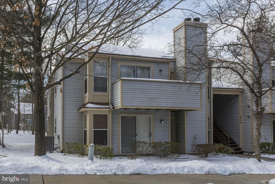 Lovely garden-level condo with open-concept living. Step inside to find a warm & inviting living room with hardwood floors; wd-burning fireplace w/access to the covered patio. The kitchen features a quaint brfst-nook &laundry space. Newly installed plush carpeting in bedrooms & freshly painted! MBD w/walk-in cl; dual-entry BA& sliders to patio; Exterior siding & roof to be replaced; Welcome Home!