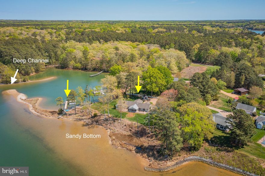 Waterfront home on 1.65 acres with 1,025' of shoreline on Moran Creek and views of the Corrotoman River. Features include 4–5' MLW, sandy beach area, protected dock with power/water, boat lift, 2025 floating dock with kayak launch and a waterside saltwater pool. The 2,949 sq. ft. main home offers a waterside living/dining room; kitchen with gas cooking, granite counters and center island; two ensuite bedrooms with walk‑in closets and water views; study with wood‑burning fireplace; family room with wet bar and 3‑sided gas fireplace and waterside screened porch. A detached two‑car garage includes a 1,354 sq. ft. guest house with a first floor waterside living room with gas fireplace, kitchen and full bath, two second‑floor waterside bedrooms with bonus rooms and a full hall bath. Landscaped yard, garden shed, and stunning sunset views complete this exceptional waterfront offering!
