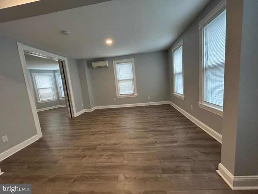 Welcome to this completely remodeled, 2 bedroom  apartment in the quaint town of Langhorne Borough.  This unit is located on the 2nd and 3rd floor of the building. There is a private entrance that takes you to second floor where you have a beautiful kitchenette with granite counters and brand new stainless steel appliances, a large living room, full bath with walk in shower with glass doors, laundry area with stackable washer/dryer, and an additional room (11'x18') that has doors and could be used as a 3rd bedroom or a dining room.  All flooring is luxury vinyl tile and there are mini-split heat/air conditioners.   The 2nd set of stairs takes you to the two bedrooms on the 3rd floor. There is also a powder room on this floor.  Water, sewer, trash and snow removal are included in the rent.