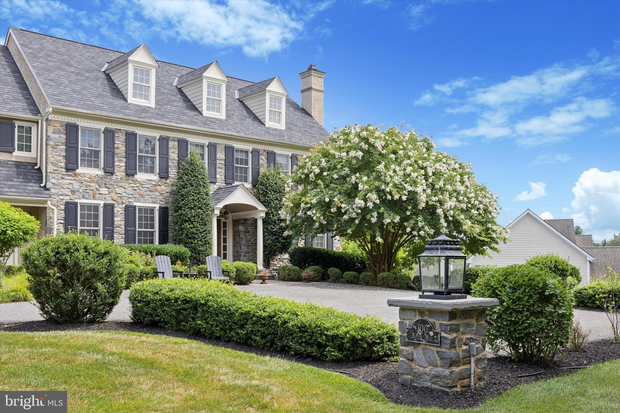 Welcome to 100 Water Mill Lane, a stunning showcase of semi-custom stone-front homes nestled in the prestigious enclave of Water Mill in Media, PA. This exclusive community offers the perfect blend of luxury, comfort, and convenience, all within the bounds of the notable Rose Tree Media school district.
As you enter this meticulously crafted home, you are greeted by an elegant foyer that sets the tone for the exquisite craftsmanship and attention to detail found throughout. The spacious floor plan seamlessly combines modern amenities with timeless design, creating an inviting atmosphere for both entertaining and everyday living.
The gourmet kitchen, complete with SubZero and Wolf appliances and wine cooler, custom cabinetry, and a center island, is a chef's dream come true. The Butler's area is complete with granite wet bar, ample cabinetry and a full Pantry closet. The adjacent living spaces, including a gracious family room with inviting gas fireplace and custom millwork cabinetry and formal dining area, provide the ideal setting for hosting gatherings and creating cherished memories with loved ones.
Upstairs, the luxurious master suite offers a serene retreat with a spa-like en-suite bath and ample closet space, 2 walk in closets and a dressing area. Additional bedrooms and well-appointed bathrooms ensure comfort and privacy for family members and guests alike.
Outside, the meticulously landscaped grounds offer a private oasis for relaxation and outdoor enjoyment. Whether it's a quiet morning coffee on the deck or a lively barbecue with friends, or formal cocktails in the front courtyard, the possibilities of the backyard and outdoor spaces are unlimited.
Conveniently located in an excellent school district, this home offers access to top-notch educational opportunities for growing families. The nearby amenities, including shopping, dining, and entertainment options, further enhance the appeal of this exceptional location. Easy access to Center City, King of Prussia, the Main Line, West Chester and the New Jersey shore points as well as accessibility to the train for commuters.
Don't miss the opportunity to experience the epitome of luxury living in this prestigious enclave. Schedule a showing today and make 100 Water Mill Ln. your new address for sophisticated suburban living.