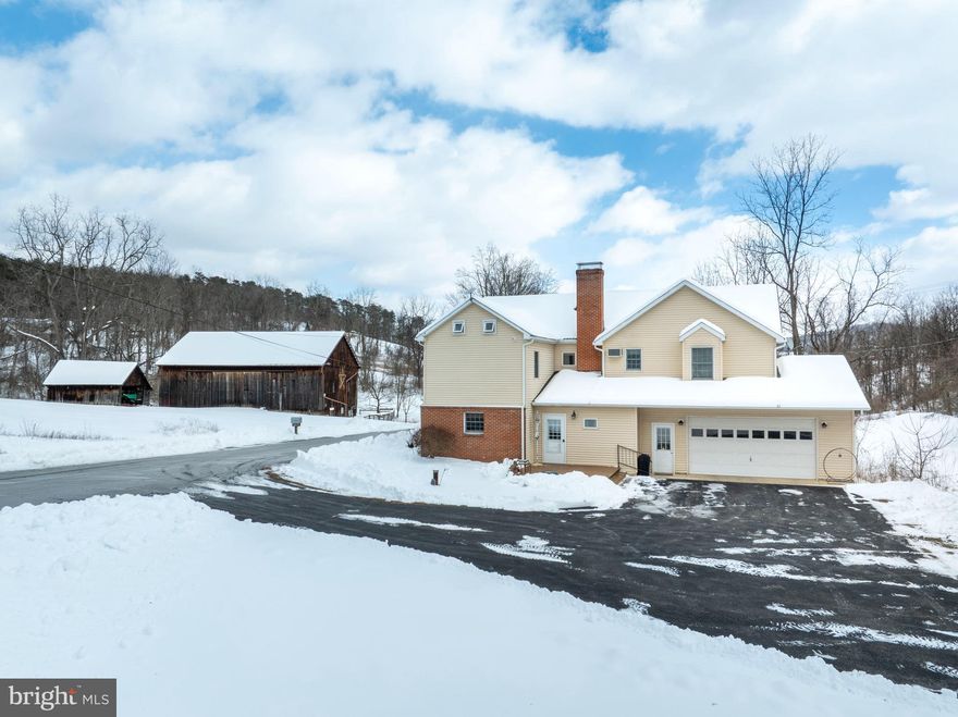 A rare opportunity to own expansive acreage with endless possibilities! Discover a truly unique rural property set on 113 picturesque acres in Alexandria, offering a beautiful mix of rolling hills, wooded areas, tillable fields, and an electric‑fenced pasture ideal for livestock or horses. Shavers Creek winds through the land, adding natural beauty and a peaceful place to explore for both recreation and agricultural use. The property includes a classic 2‑story farmhouse and a large 60x40 bank barn with water, electricity, a newer roof and floor beams, plus an equipment shed.

Originally built around 1890 and thoughtfully expanded over the years—including a 2006 addition—the farmhouse now offers 4 second‑floor bedrooms and 3 full baths, with the laundry conveniently located upstairs. The main level features a traditional layout with a cozy living room anchored by a stone wood‑burning fireplace, a charming eat‑in kitchen, and a formal dining room with a brick accent wall and mantle. Beautiful hardwood floors run from the foyer into the dining area. Enjoy the screened‑in front porch or the newly built composite deck overlooking the property. Additional highlights include an oversized 2‑car attached garage with workbench space, a whole‑house fan, a chlorinated water treatment system, and an unfinished basement ideal for storage or hobbies. This sprawling property is perfect for those who love the outdoors and want space to farm and enjoy the countryside. Schedule your tour today!

A one‑acre portion of the land is leased long‑term to a neighbor, and the fields are currently leased to a neighboring farm. See documents for more details.