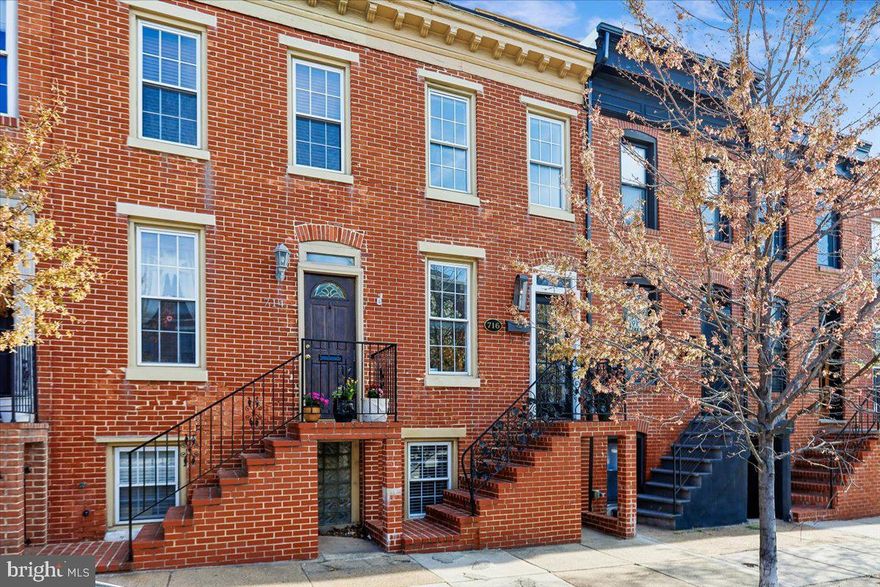Perfectly located in the Riverside-Federal Hill area, this remarkable and classic Baltimore brick fronted rowhome features three bedrooms and three bathrooms, hardwood floors, exposed brick, a private parking pad and a rooftop deck with City and Harbor Views that will absolutely blow you away. Short distance and access to the gym, shopping, the water taxi and UA Campus. Fresh paint and new carpet make this home turnkey and move in ready. Modern appliances and lighting combined with exposed brick walls and milled woodwork make for a very charming space and home. Multiple decks and a rear oasis accentuated by gardens will make your outdoor entertainment dreams come true. Investors looking to build their rental portfolios could also take advantage of this opportunity as the layout is perfect for a rental property. Roof with a fresh white silicone coating.